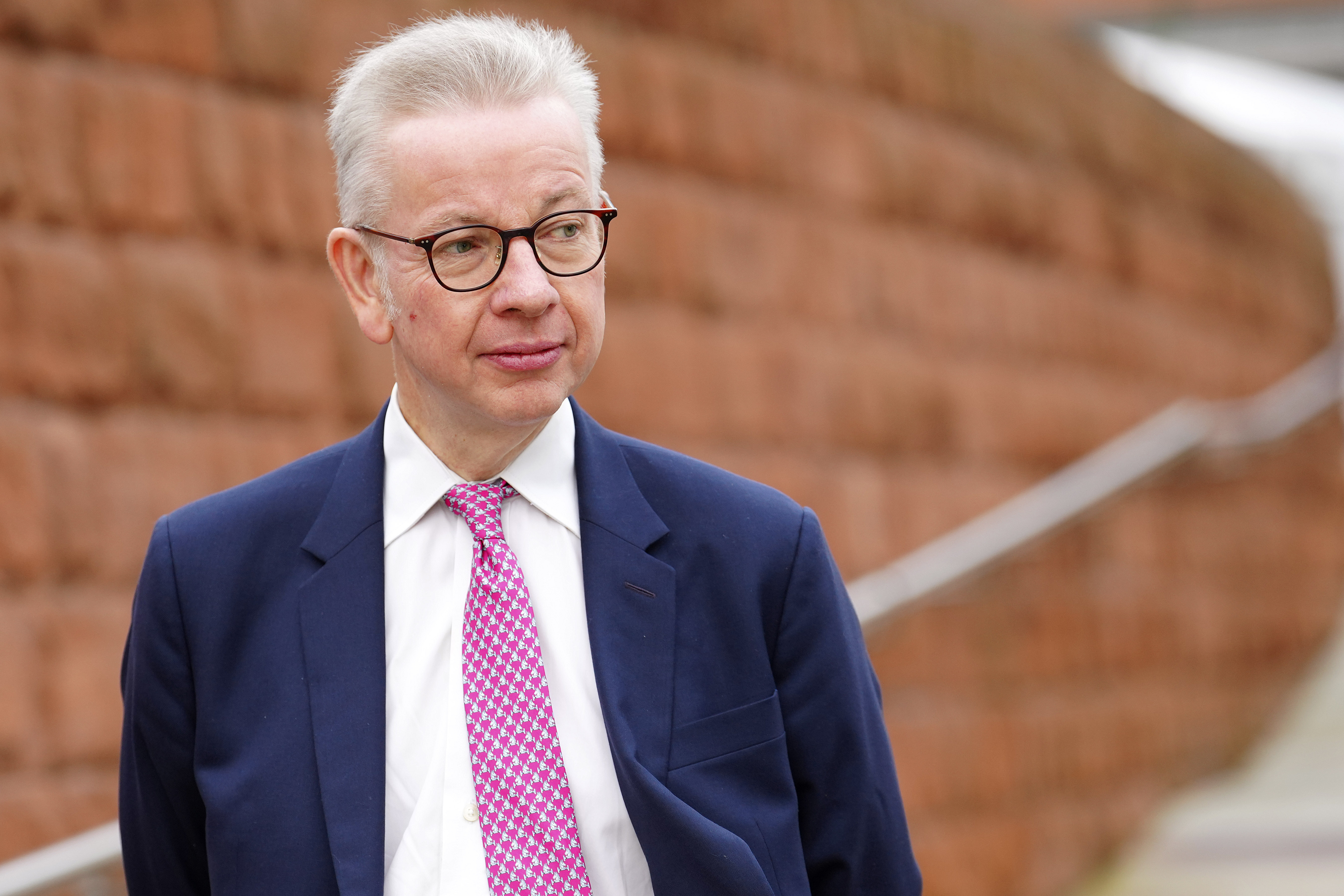 FILE - Then-Secretary of State Michael Gove arrives at the Conservative Party annual conference at Manchester Central convention complex in Manchester, England, Wednesday, Oct. 4, 2023. (AP Photo/Jon Super, File)