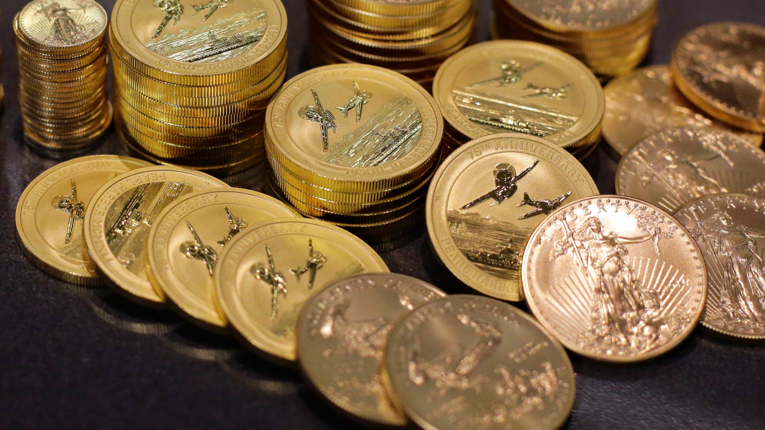 FILE - Gold coins are displayed at the office of Philip Diehl in Austin, Texas on July 1, 2016. (AP Photo/Eric Gay, File)