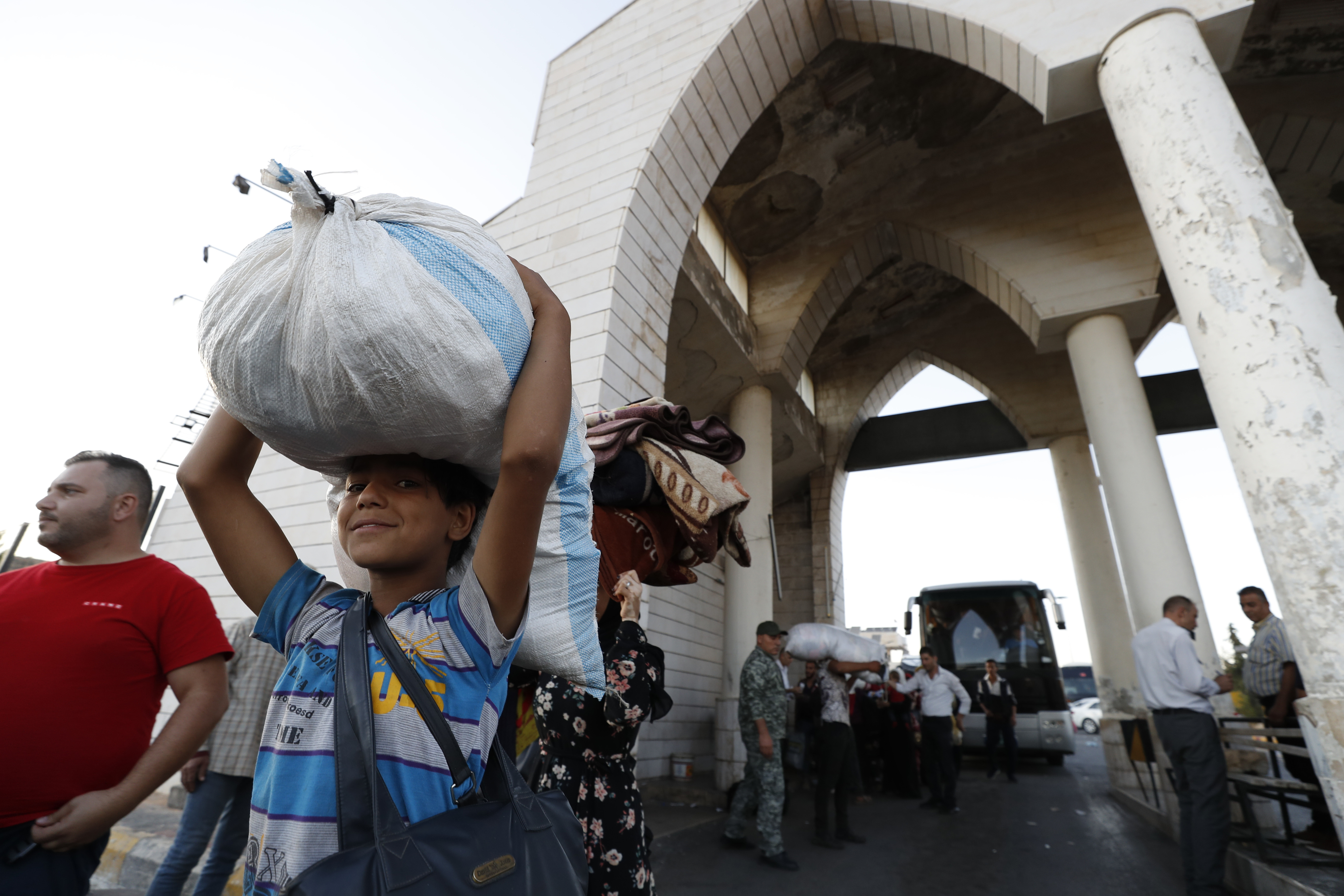 A Syrian boy fleeing the war in Lebanon with his family, arrives at the Syrian-Lebanese border crossing in Jdeidet Yabous, Syria, Wednesday, Sept. 25, 2024. (AP Photo/Omar Sanadiki)