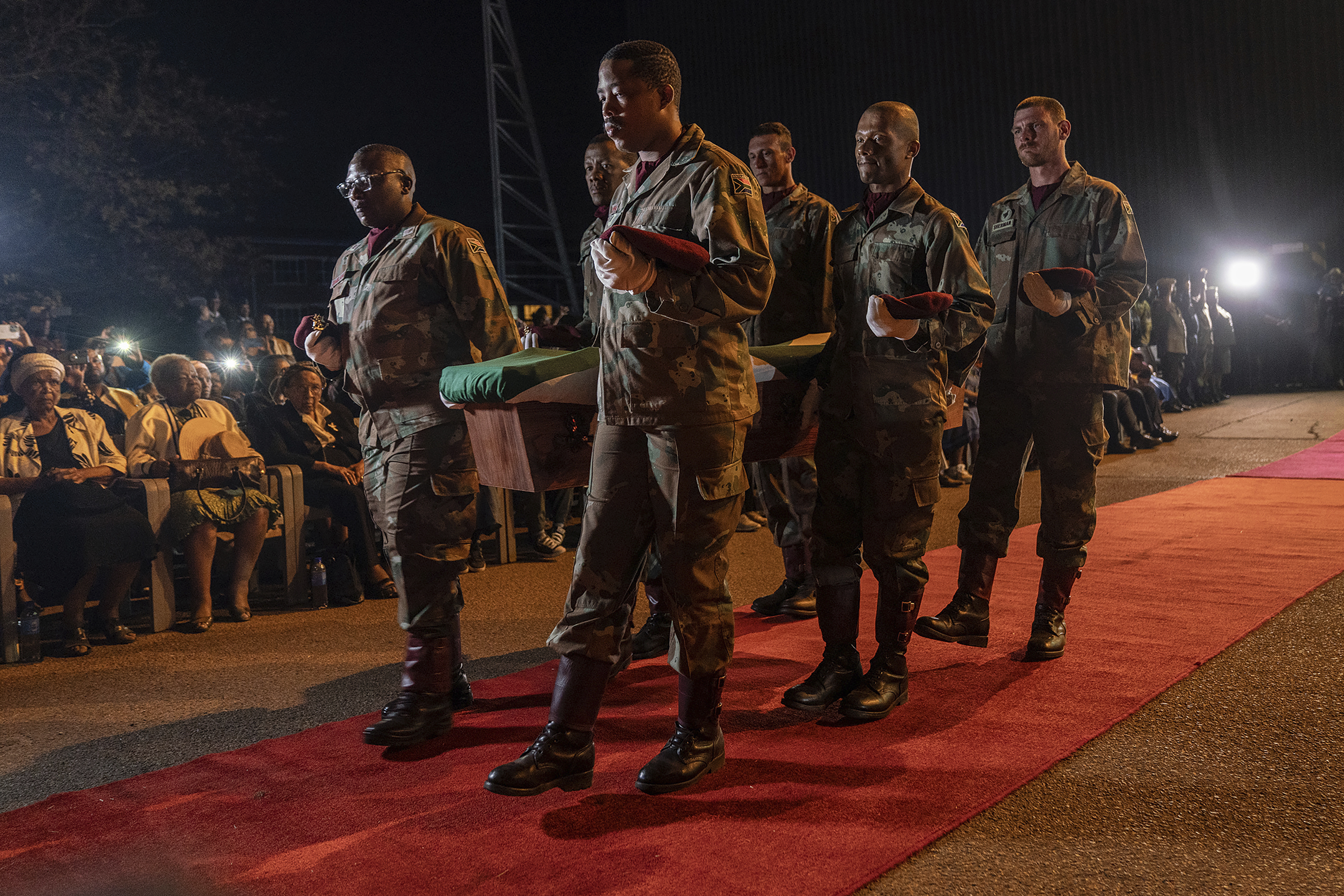 One of the remains of South Africans who died while exiled in Zimbabwe and Zambia during the struggle against white minority rule arrive at the Waterkloof Air Force Base in Pretoria, South Africa, Wednesday, Sept. 25, 2024. (AP Photo/Shiraaz Mohamed)