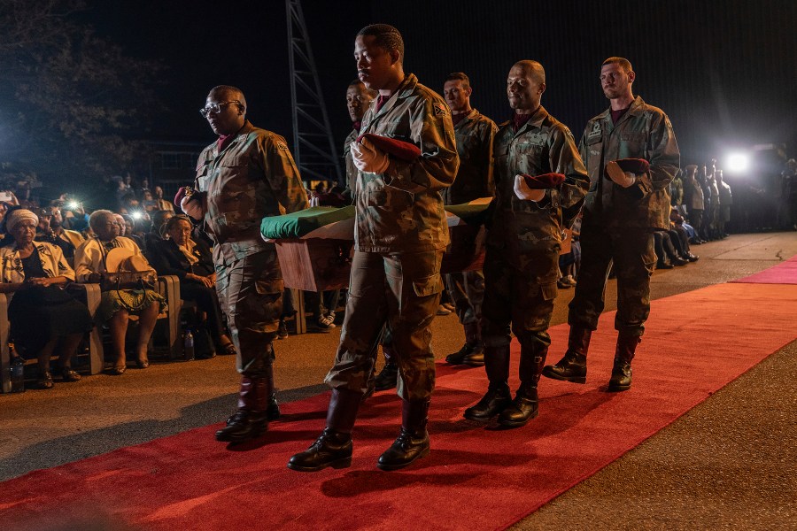 One of the remains of South Africans who died while exiled in Zimbabwe and Zambia during the struggle against white minority rule arrive at the Waterkloof Air Force Base in Pretoria, South Africa, Wednesday, Sept. 25, 2024. (AP Photo/Shiraaz Mohamed)