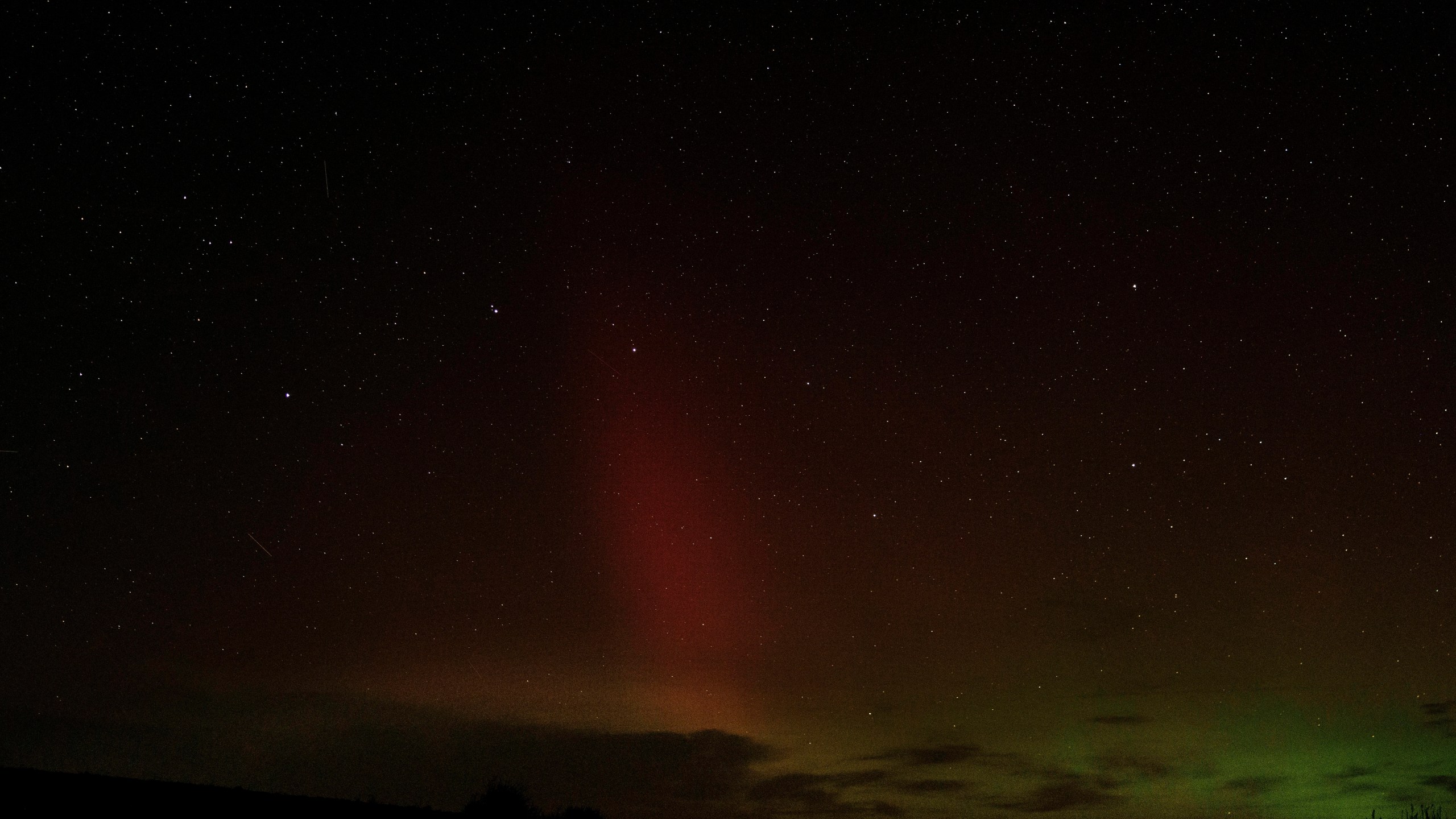 An aurora borealis, also known as the northern lights, is seen in the night sky with the Big Dipper constellation on Tuesday, Sept. 24, 2024, near Washtucna, Wash. (AP Photo/Ted S. Warren)