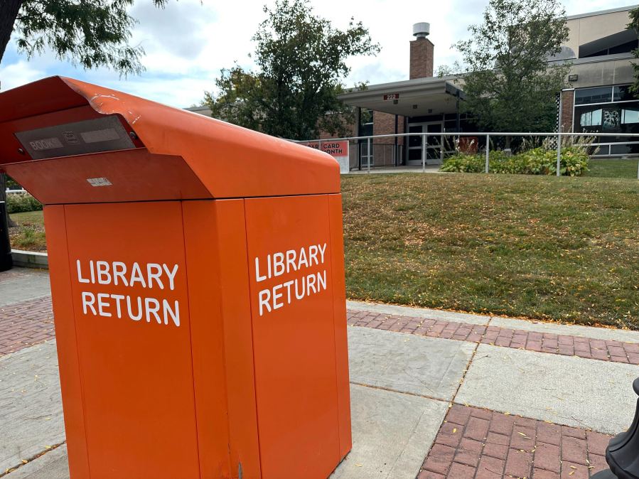 The return box sits outside of the closed library, Monday, Sept. 23, 2024, in Royal, Oak, Michigan, after someone returned a DVD with bugs inside the case. (AP Photo/Mike Householder)