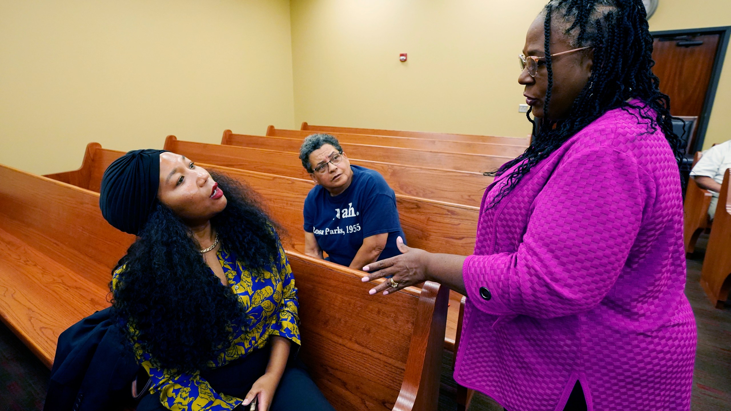 FILE - Jill Collen Jefferson, president of JULIAN, a civil rights and international human rights law firm, left, and Bonita Streeter, a bail bondsman and community activist, center, confer with Mitzi Dease Paige, an Assistant U.S. Attorney with the Southern District of Mississippi, right, during the Lexington, Miss., stop on the division's civil rights tour, June 1, 2023. (AP Photo/Rogelio V. Solis, File)