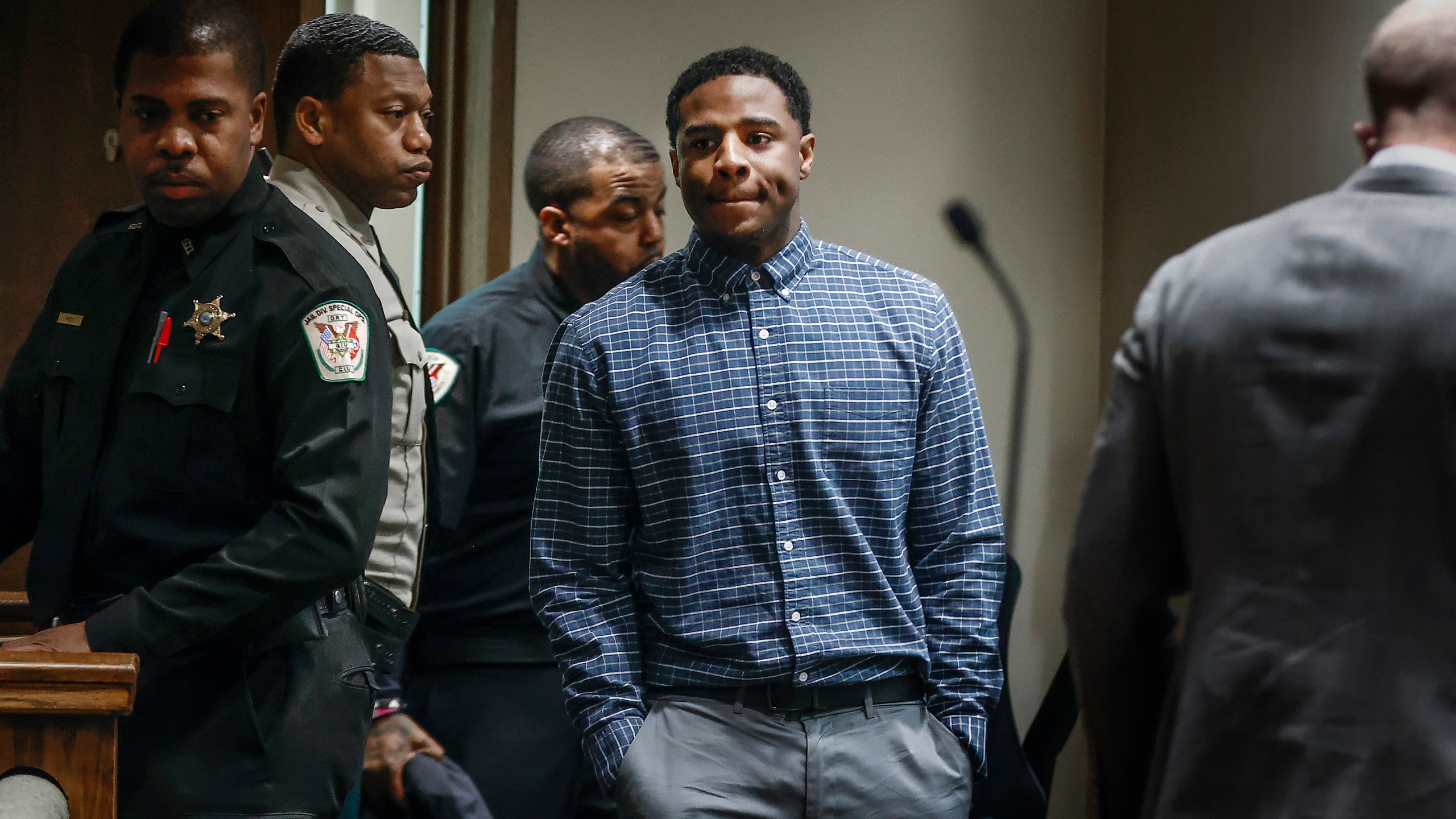 Defendant Justin Johnson, center, enters court before being found guilty of murder in the death of Memphis rapper Young Dolph, in court in Memphis, Tenn., on Thursday, Sept. 26, 2024. (Mark Weber/Daily Memphian via AP, Pool)