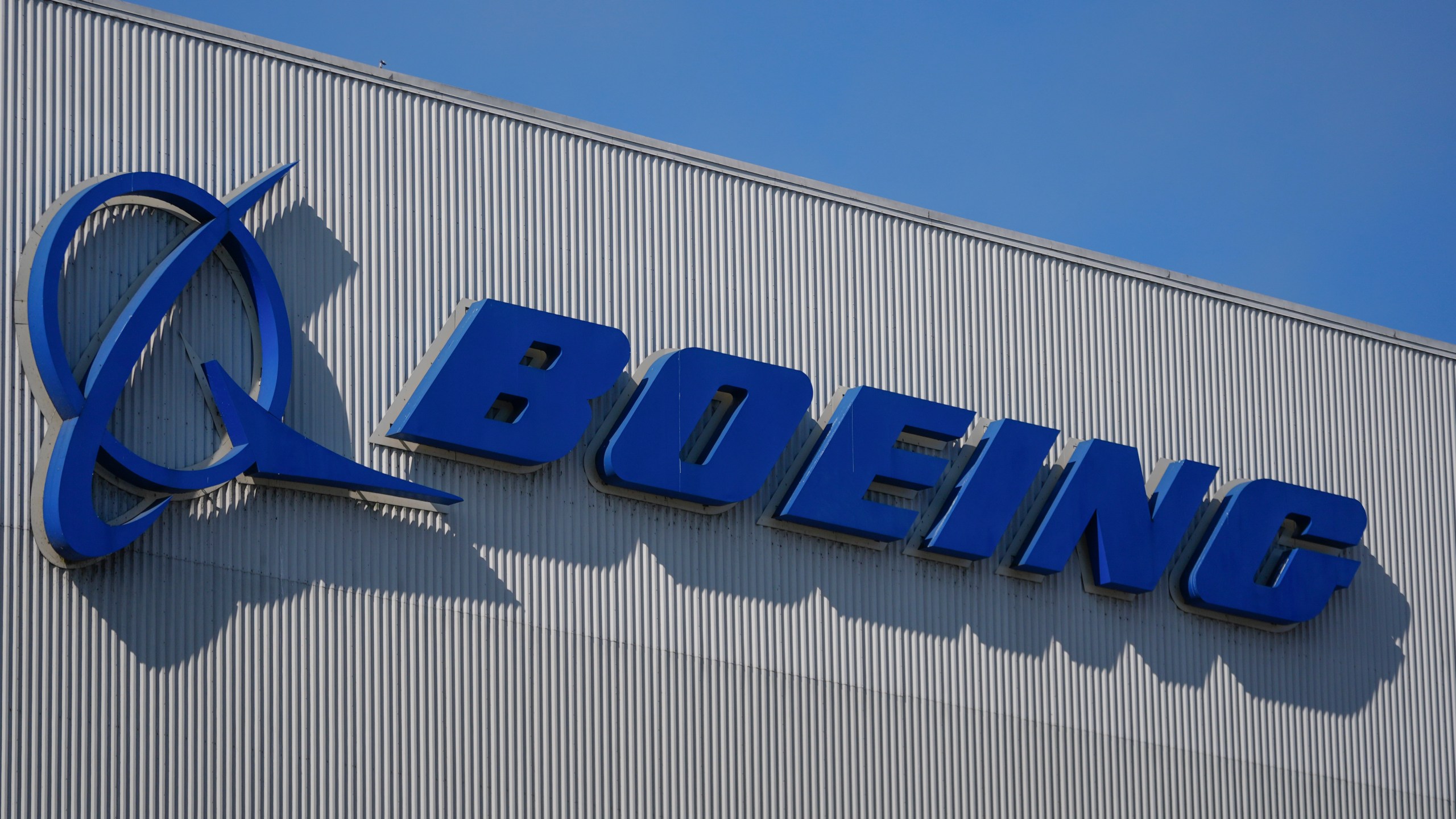 The Boeing logo is displayed at the company's factory Tuesday, Sept. 24, 2024, in Renton, Wash. (AP Photo/Lindsey Wasson)