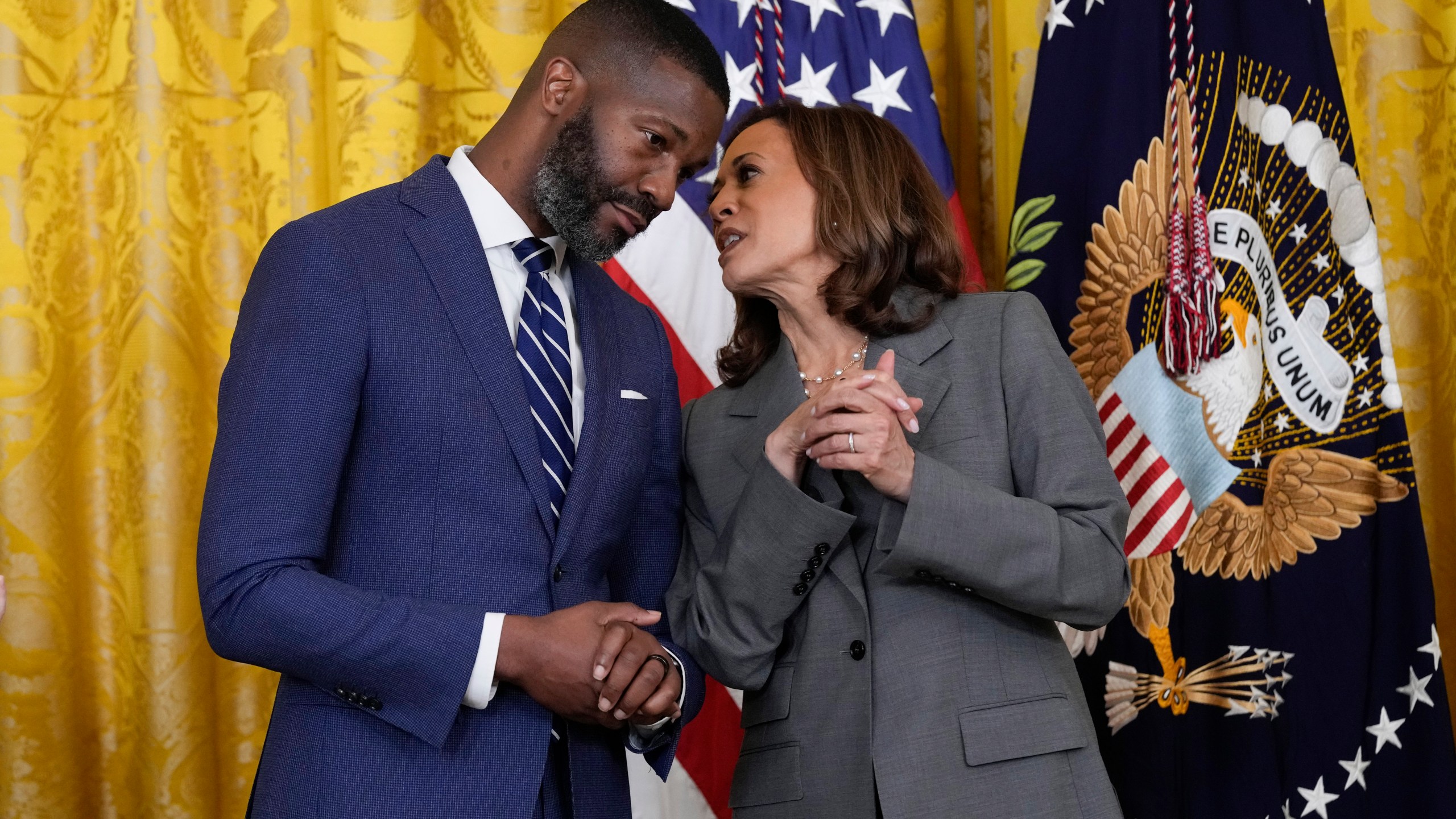 Vice President Kamala Harris talks with Mayor Randall Woodfin, Birmingham, Ala., in the East Room of the White House in Washington, Thursday, Sept. 26, 2024, during an event on gun violence in the United States. (AP Photo/Susan Walsh)