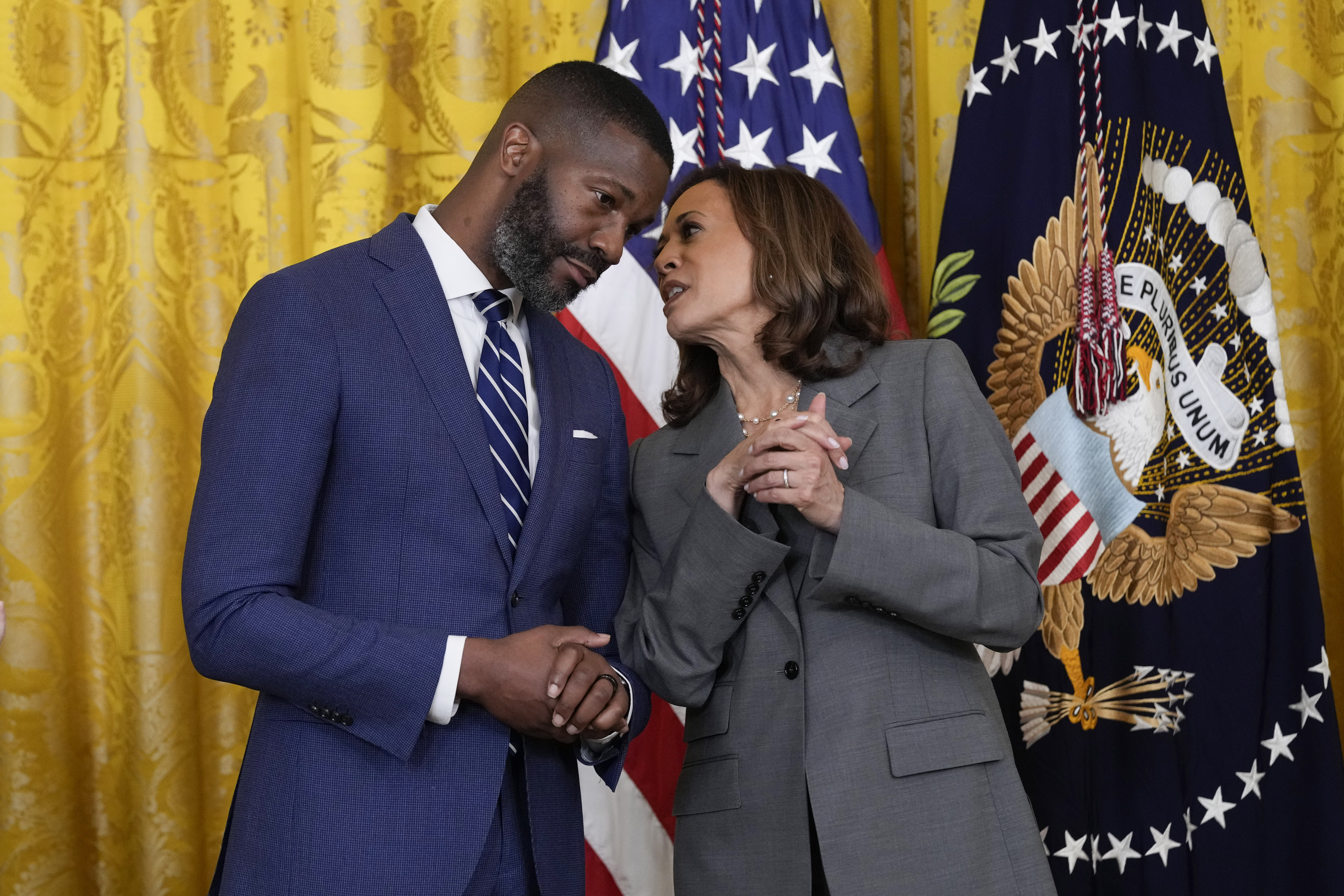 Vice President Kamala Harris talks with Mayor Randall Woodfin, Birmingham, Ala., in the East Room of the White House in Washington, Thursday, Sept. 26, 2024, during an event on gun violence in the United States. (AP Photo/Susan Walsh)