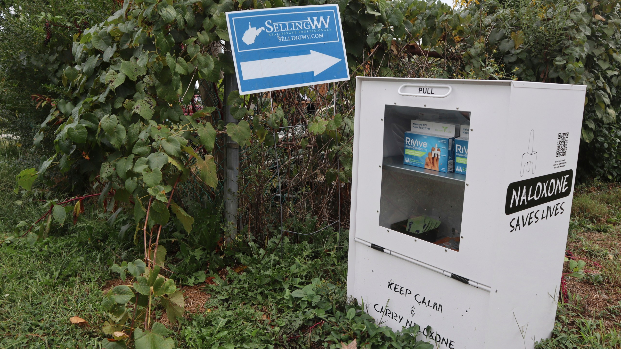 A new naloxone distribution box sits in a residential neighborhood in Hurricane, W.Va. on Tuesday, Sept. 24, 2024. (AP Photo/Leah Willingham)