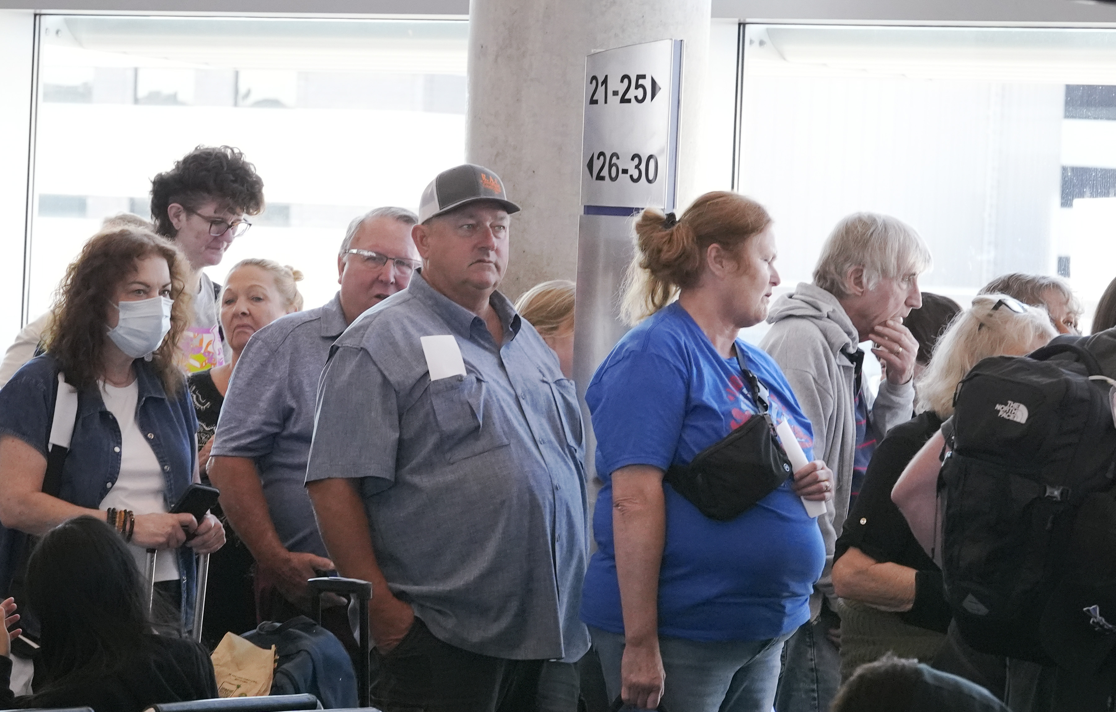 FILE - Travelers line up to board a Southwest Airlines plane at Love Field in Dallas, Thursday, July 25, 2024. (AP Photo/LM Otero, File)