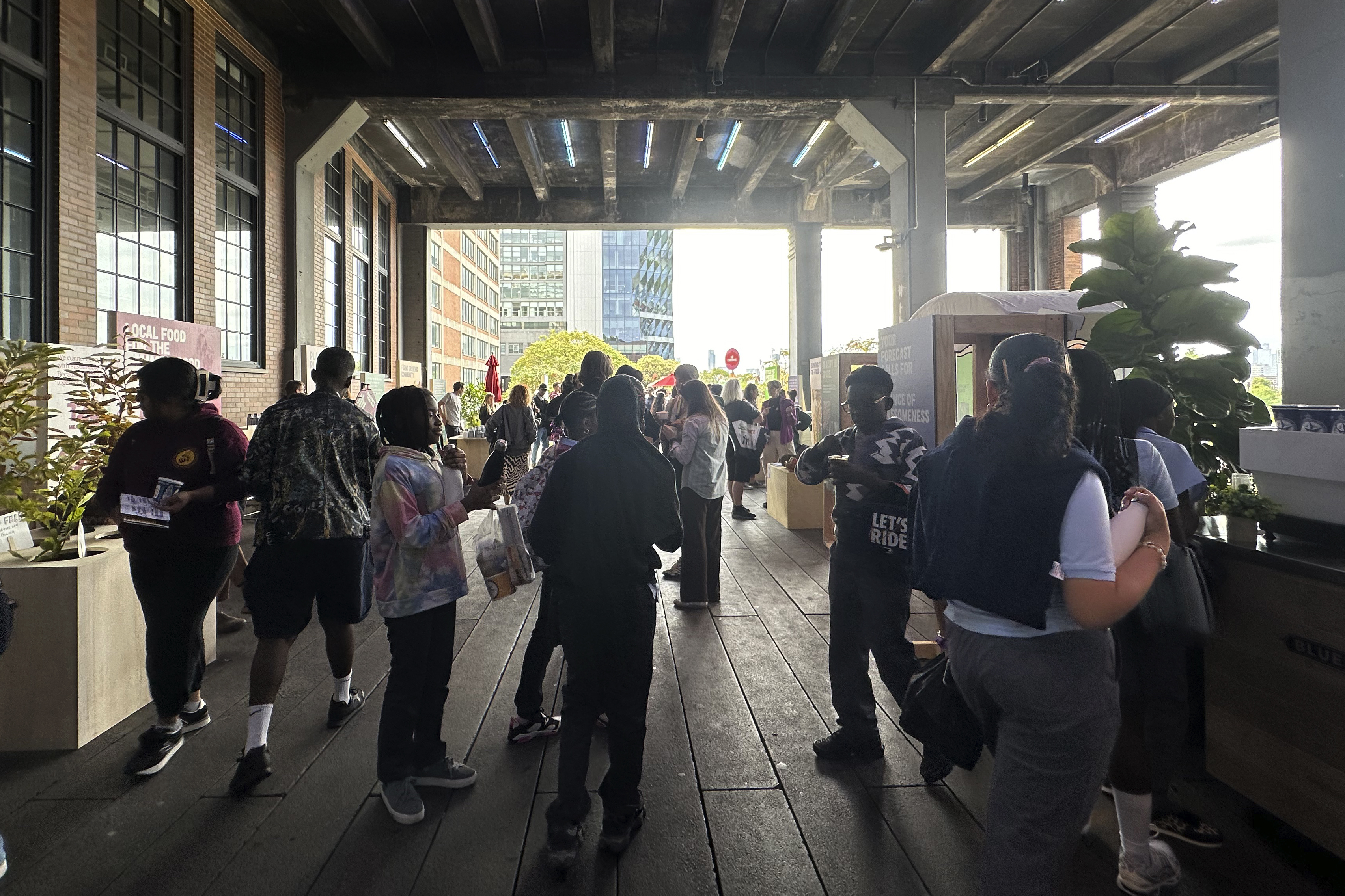 People look at exhibits at the Climate Science Fair, an outdoor exhibit hosted by the Emerson Collective during the annual Climate Week NYC and United Nations General Assembly, on Monday, Sept. 23, 2024 in New York. (AP Photo/Peter Morgan)