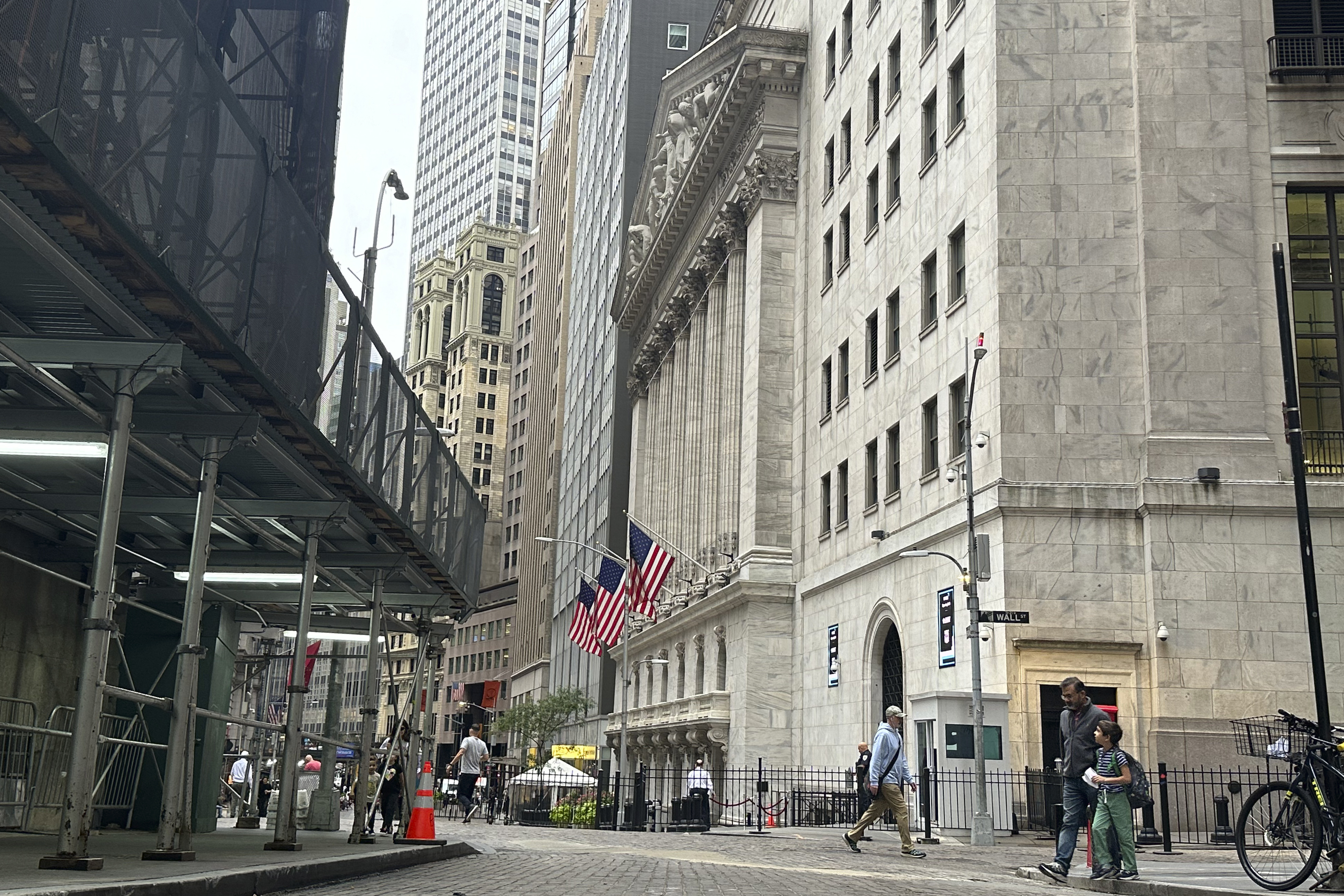 The New York Stock Exchange, center, is shown on Friday, Sept. 27, 2024, in New York. (AP Photo/Peter Morgan)