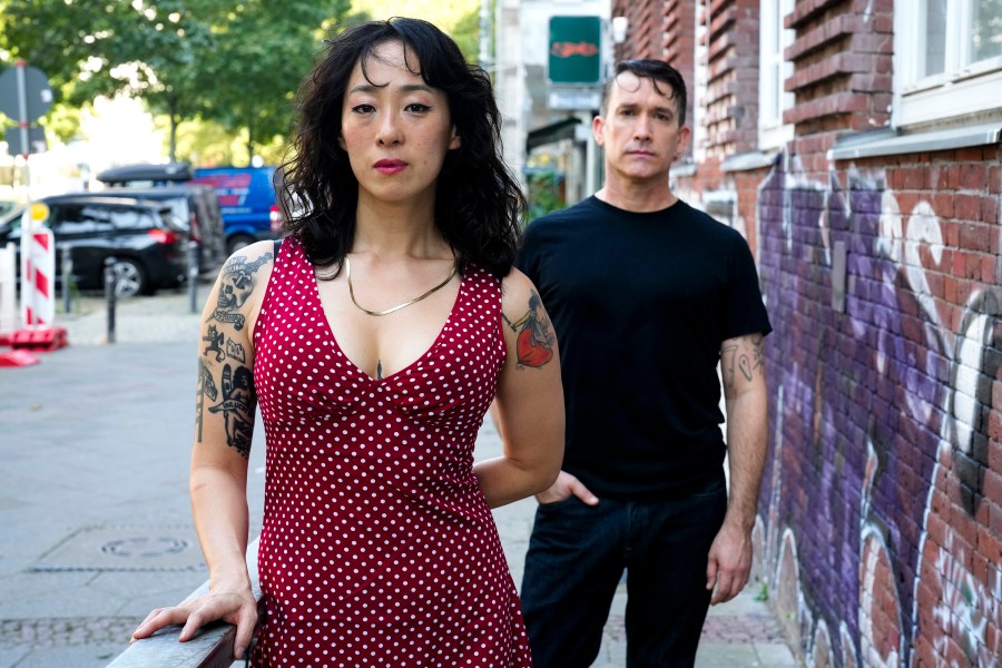 Angela Seo, left, and Jamie Stewart of the band Xiu Xiu pose for a portrait in Berlin, Germany, Wednesday, Aug. 28, 2024. (AP Photo/Markus Schreiber)