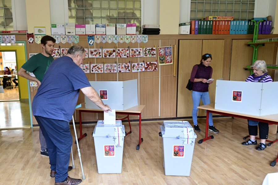 A man votes in the second round of voting for a third of the seats in Parliament’s upper house. at a polling station in Prague, Czech Republic, Friday Sept. 27, 2024. (Roman Vondrous/CTK via AP)