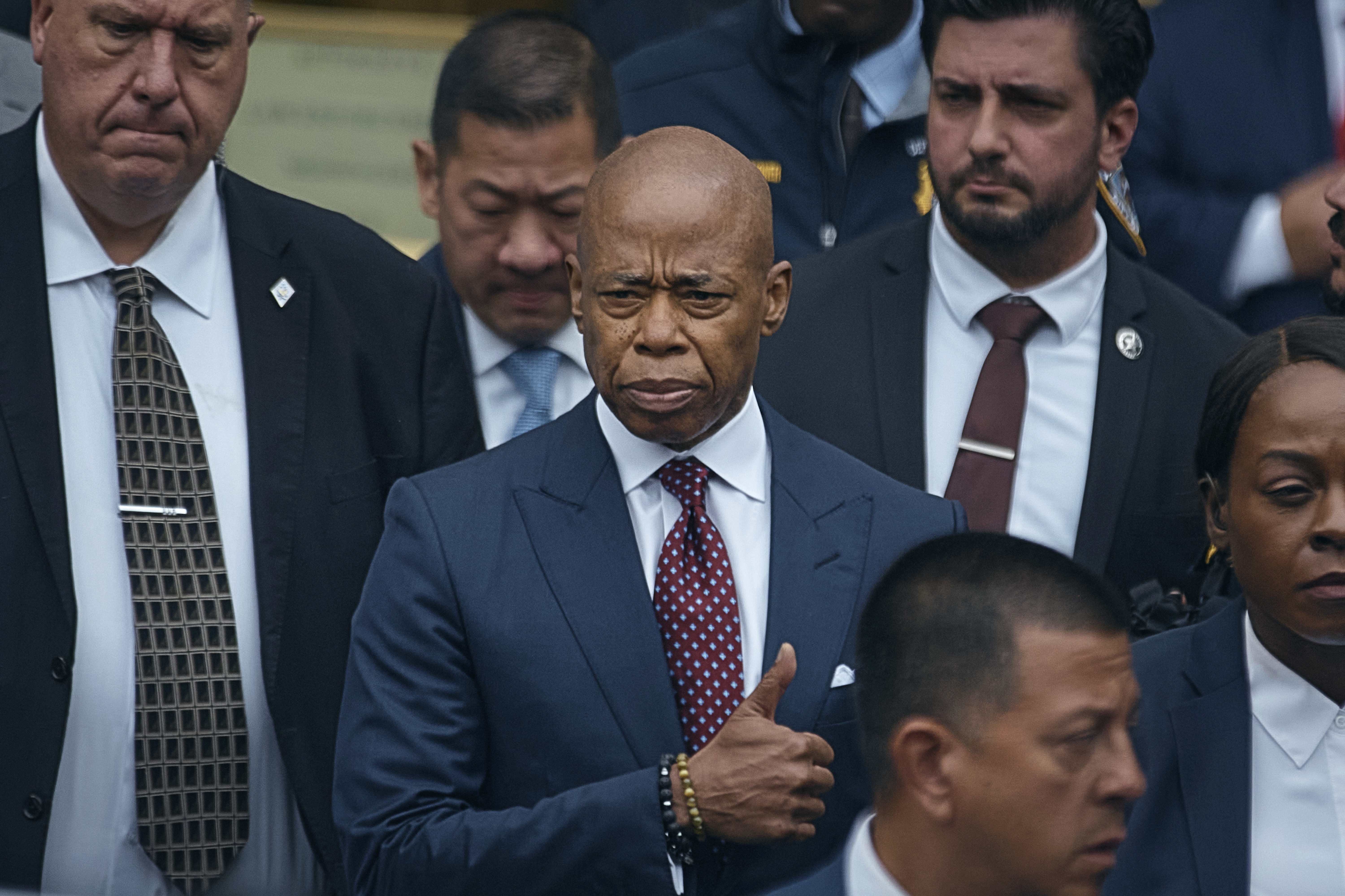 New York City mayor Eric Adams, center, leaves the Daniel Patrick Moynihan Court House in New York, on Friday, Sept. 27, 2024. (AP Photo/Andres Kudacki)