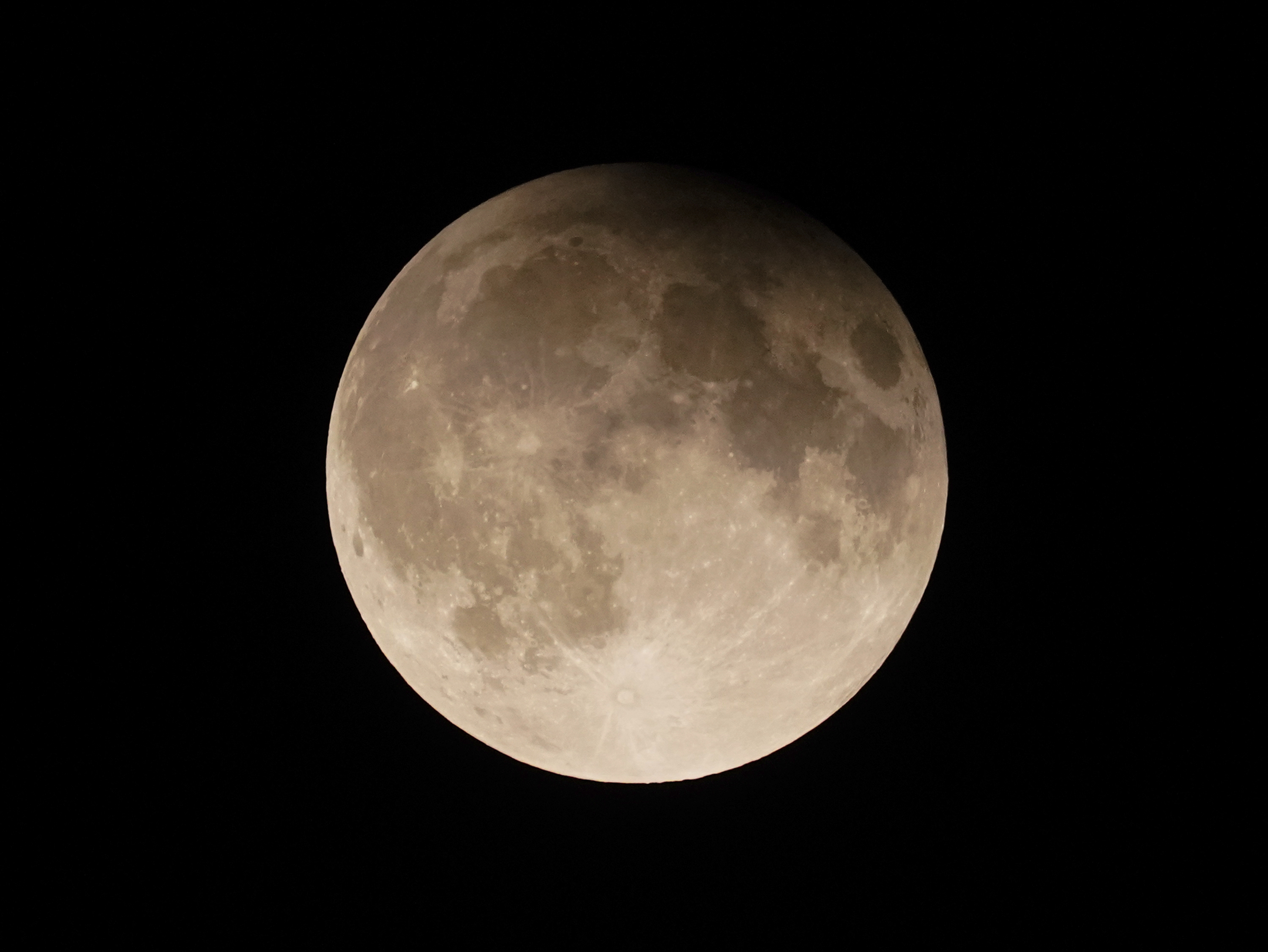 FILE - A supermoon with a partial lunar eclipse rises over Lake Michigan in Chicago, Tuesday, Sept. 17, 2024. (AP Photo/Kiichiro Sato, File)