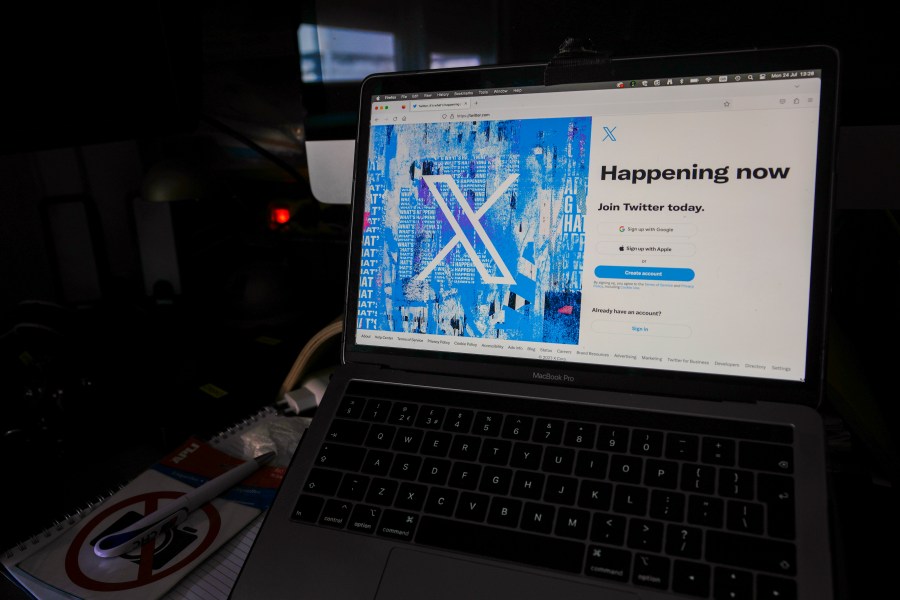 FILE - A view of a laptop shows the Twitter sign-in page with their logo, in Belgrade, Serbia, Monday, July 24, 2023. (AP Photo/Darko Vojinovic, File)