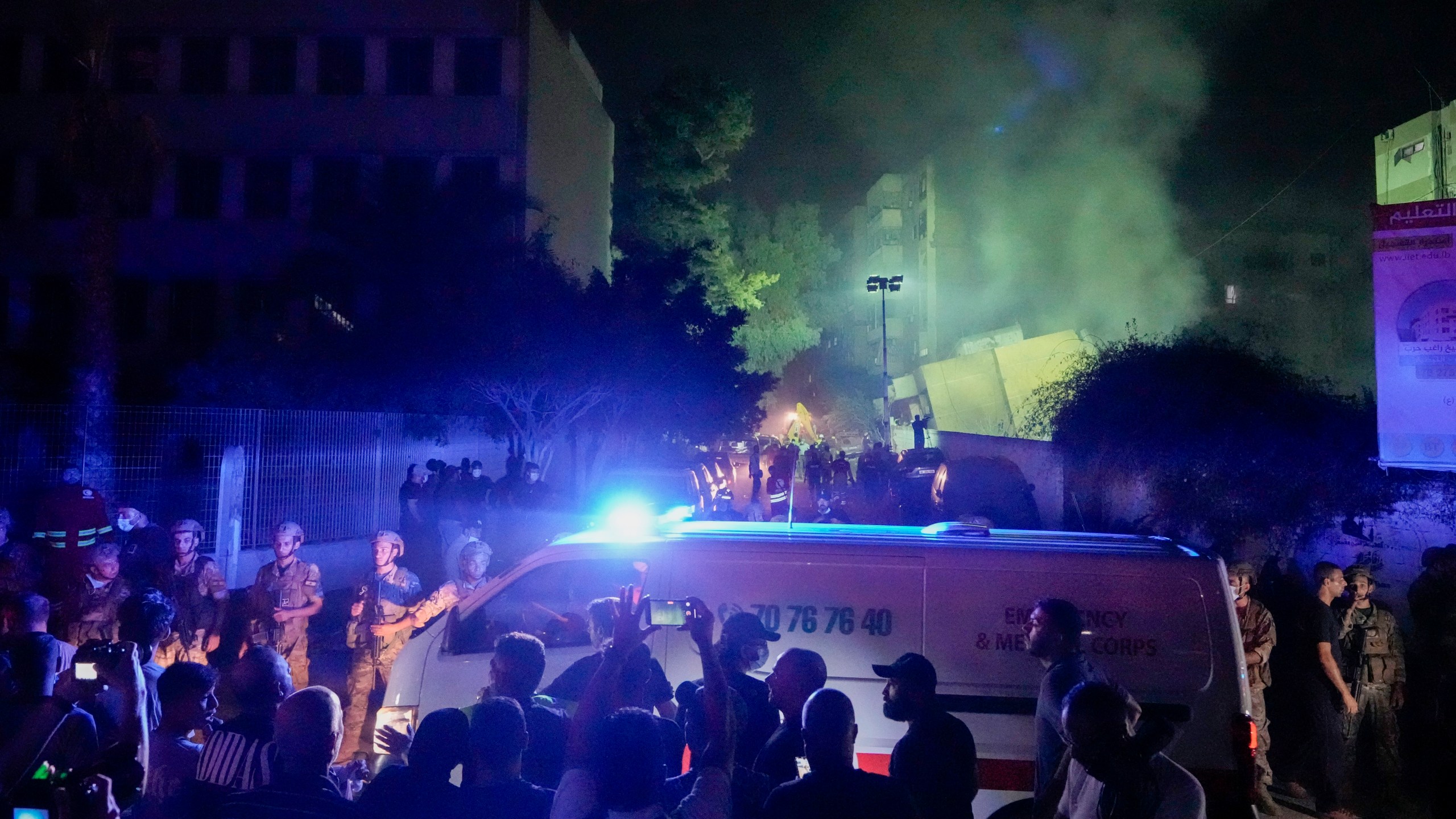 Ambulances arrive at the site of an Israeli airstrike in Beirut's southern suburbs Friday, Sept. 27, 2024. (AP Photo/Bilal Hussein)