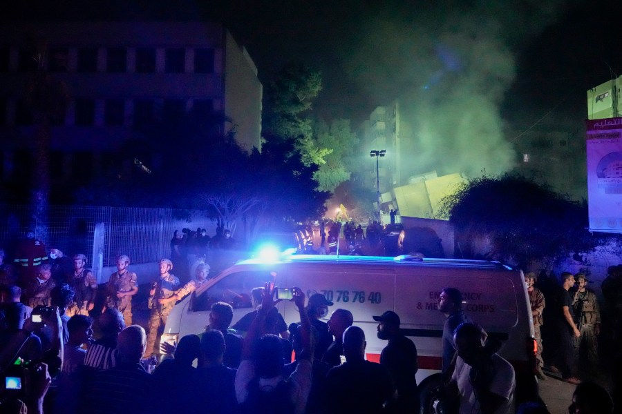 Ambulances arrive at the site of an Israeli airstrike in Beirut's southern suburbs Friday, Sept. 27, 2024. (AP Photo/Bilal Hussein)