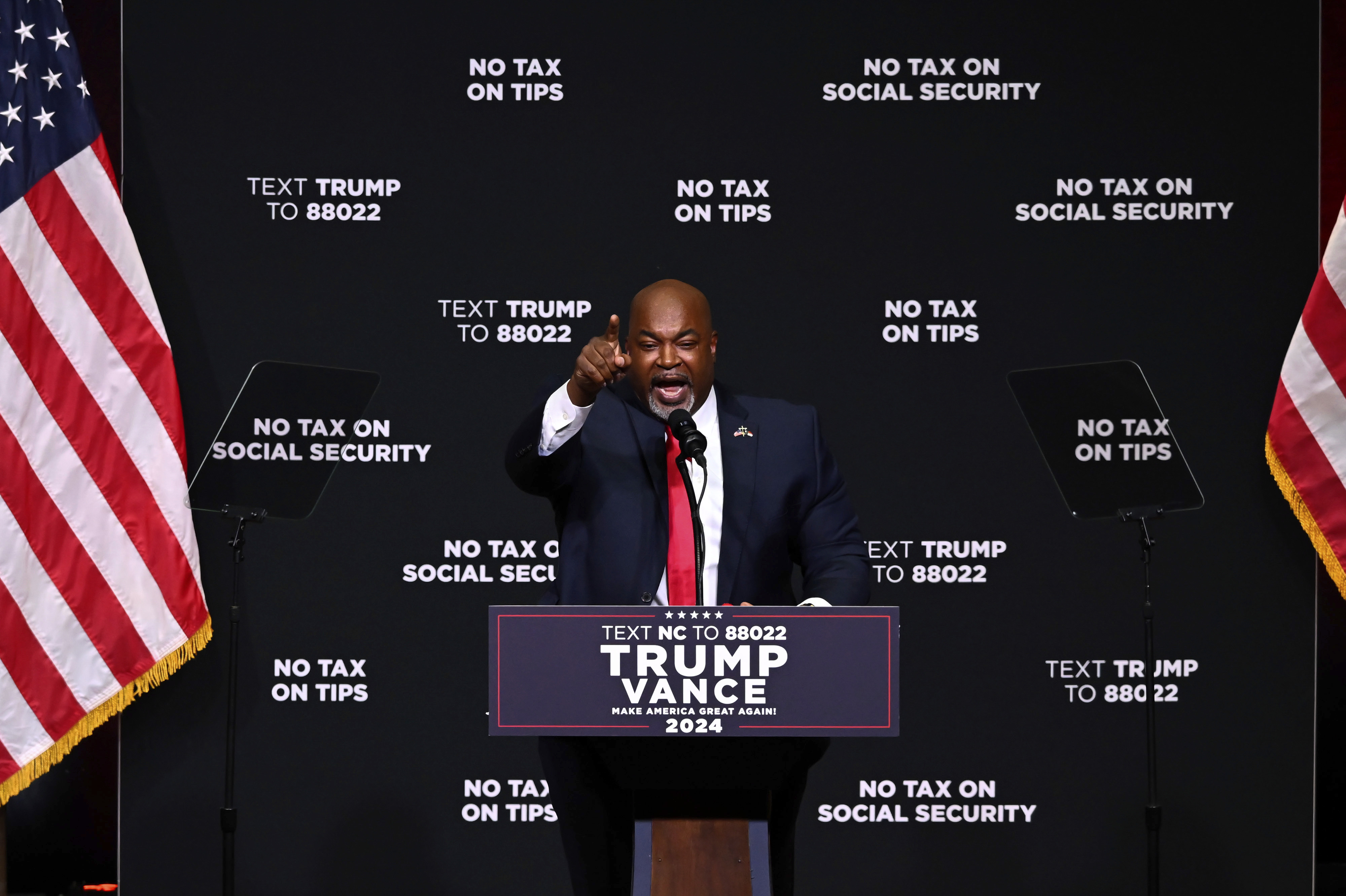 FILE - North Carolina Republican gubernatorial candidate Lt. Gov. Mark Robinson speaks before Republican presidential nominee former president Donald Trump in Asheville, N.C., Aug. 14, 2024. (AP Photo/Matt Kelley, File)