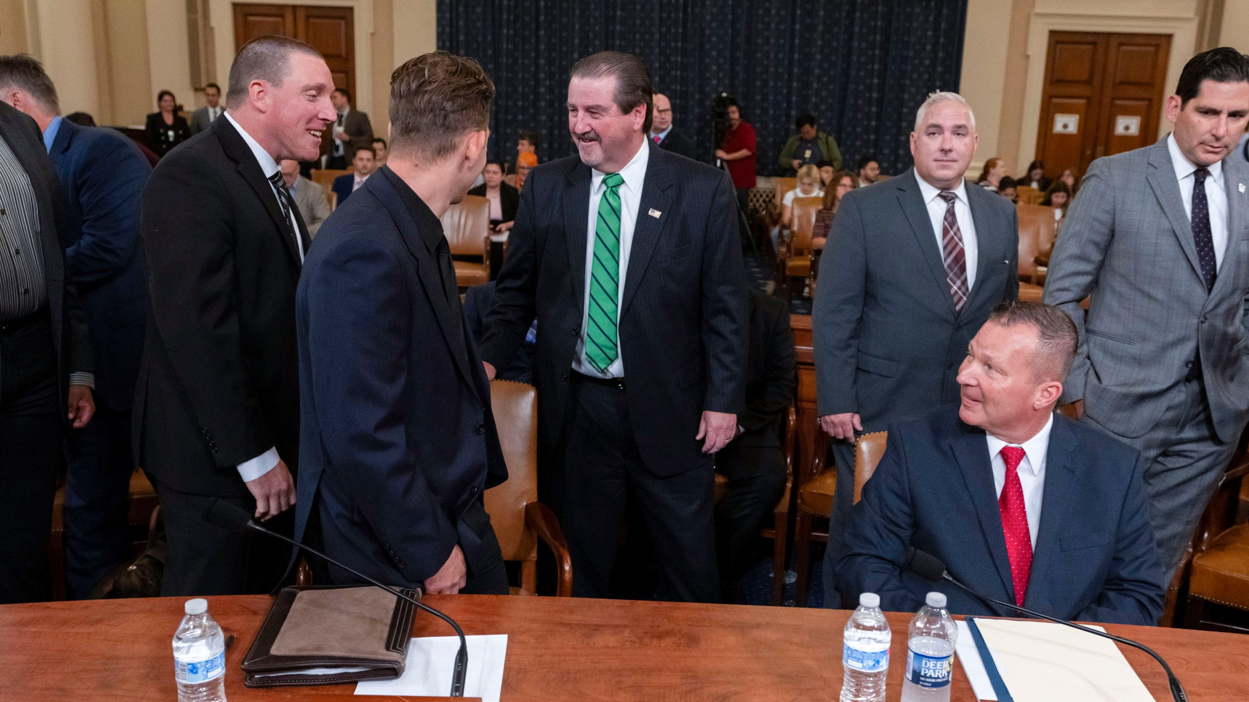 From left, Sgt. Edward Lenz, Commander of Butler County Emergency Services Unit, Patrolman Drew Blasko of Butler Township Police Department, former U.S. Secret Service agent Patrick Sullivan, and Lt. John Herold of Pennsylvania State Police, arrive to testify at the first public hearing of a bipartisan congressional task force investigating the assassination attempts against Republican presidential nominee former President Donald Trump, at Capitol Hill in Washington, Thursday, Sept. 26, 2024. (AP Photo/Ben Curtis)