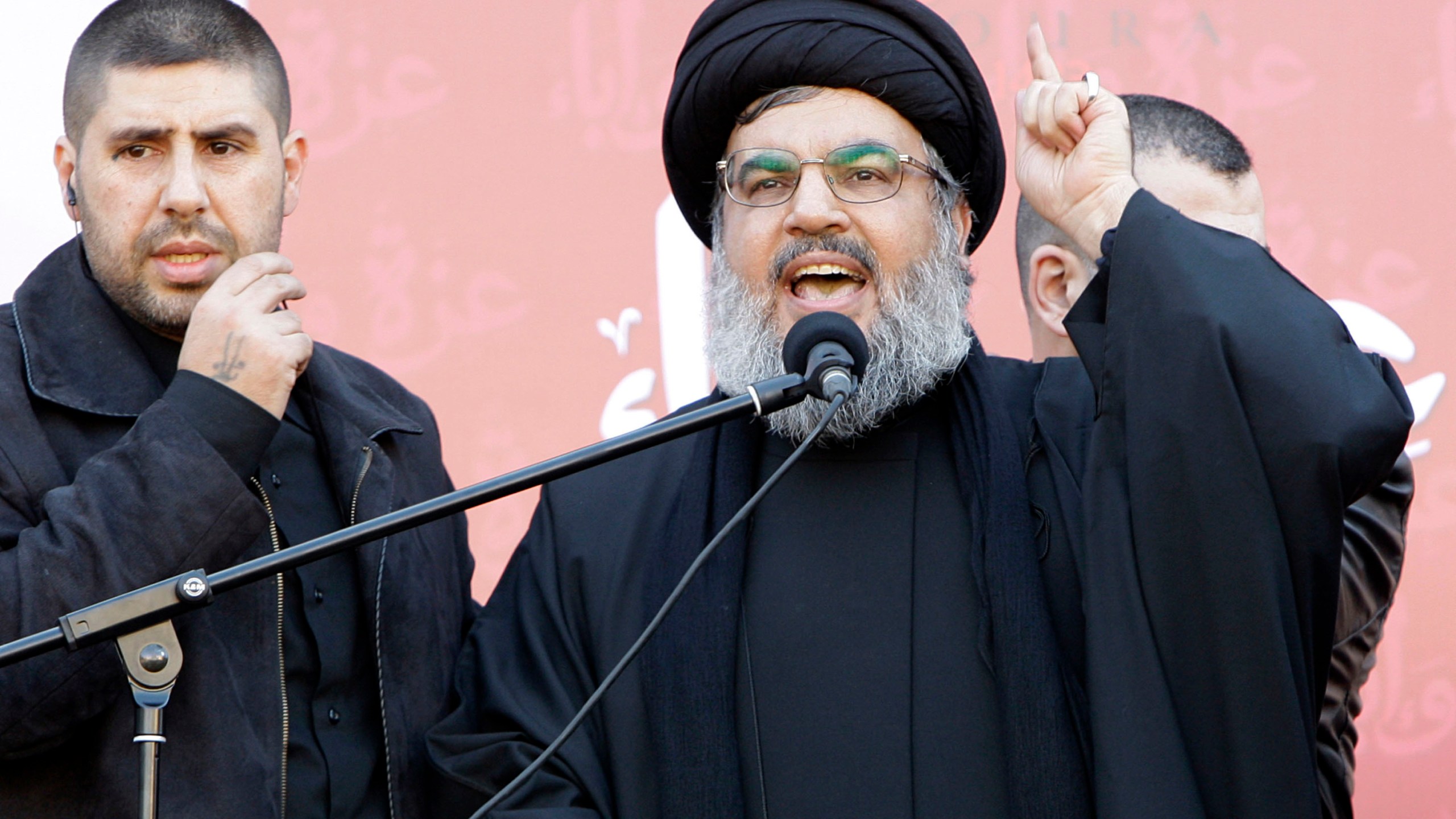 FILE - Hezbollah leader Hassan Nasrallah speaks to the crowd in a rare public appearance during a rally to mark the Muslim holy day of Ashoura, in Beirut's southern suburbs, Tuesday Dec. 6, 2011. (AP Photo/Bilal Hussein, File)