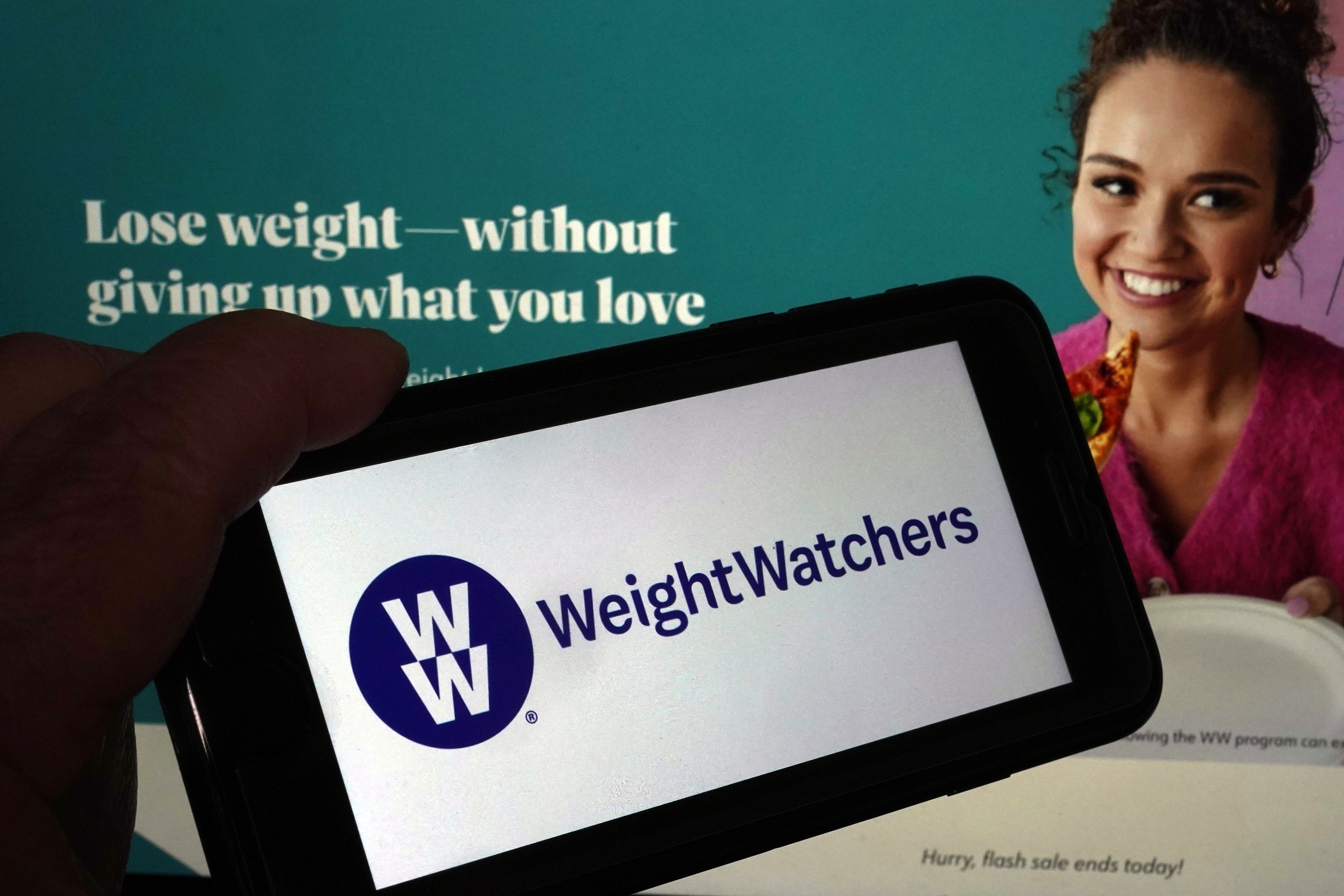 FILE - This image shows the logo of WeightWatchers on a mobile phone, and the company's website, in New York, Tuesday, March 7, 2023. (AP Photo/Richard Drew, File)