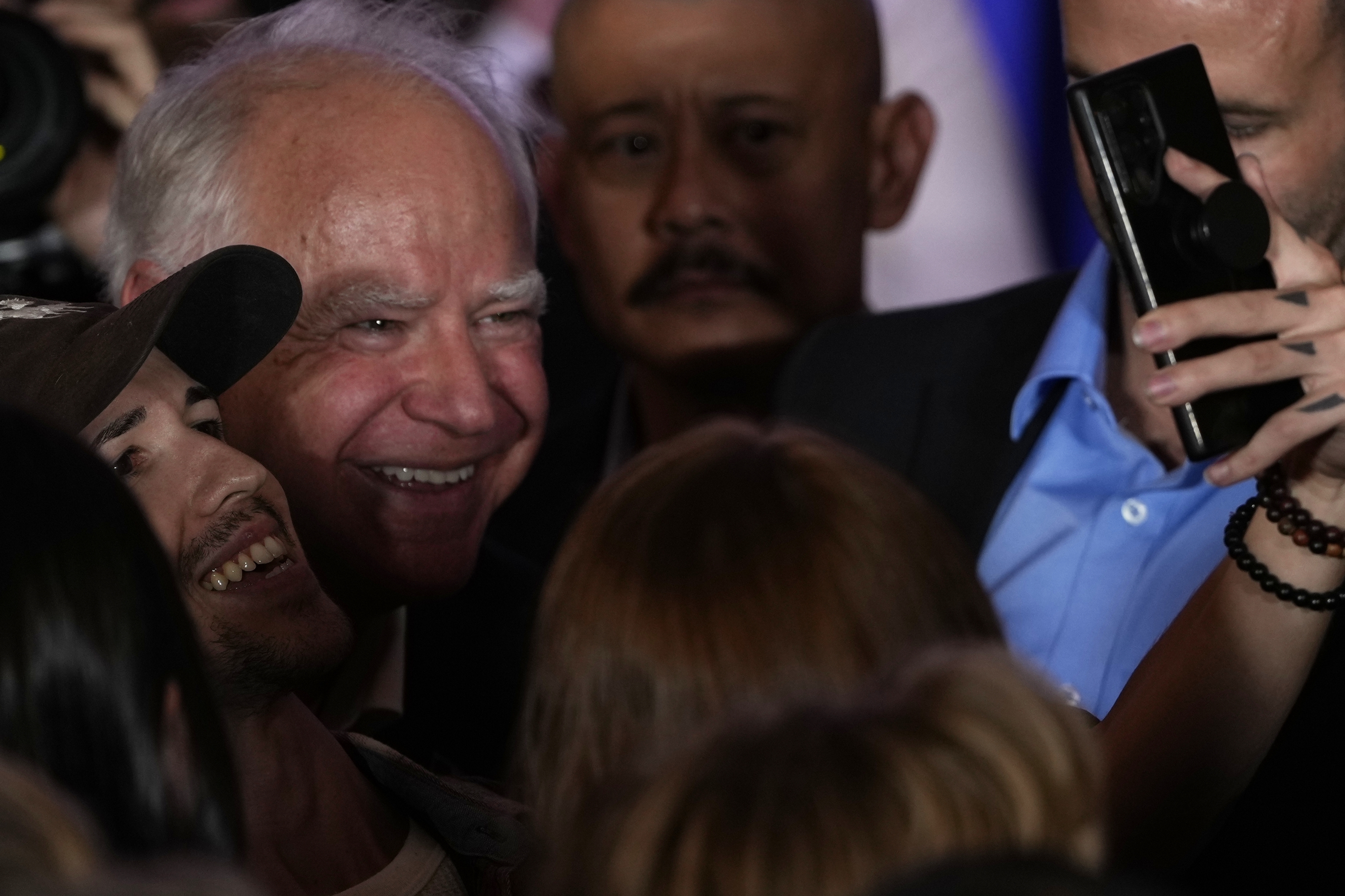 Democratic vice presidential candidate Minnesota Gov. Tim Walz poses for a picture at the Whitewater Music Hall Brewing Company Friday, Sept. 13, 2024, in Wausau, Wis. (AP Photo/Morry Gash)