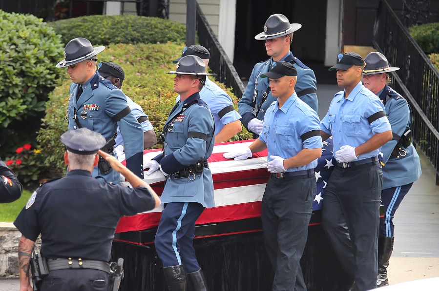 Pallbearers carry the casket of Massachusetts State Police recruit Enrique Delgado-Garcia at the start of his funeral service at the Mercadante Funeral Home in Worcester, Mass., Saturday, Sept. 24, 2024. (John Tlumacki/The Boston Globe via AP)