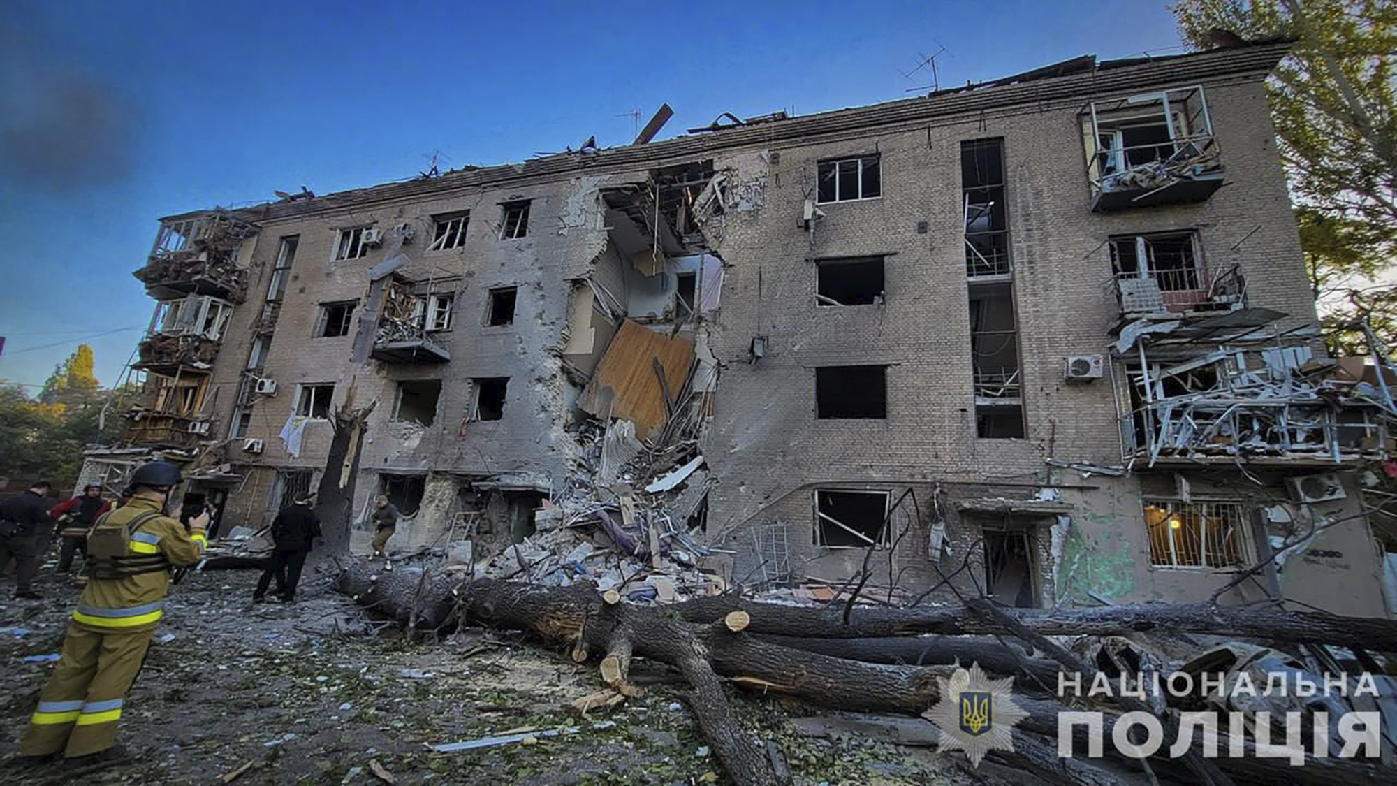 In this photo provided by the Ukrainian Police Press Office, a damaged apartment house is seen after Russia attacked the city with guided bombs overnight in Zaporizhzhia, Ukraine, Sunday, Sept. 29, 2024. (Ukrainian Police Press Office via AP)