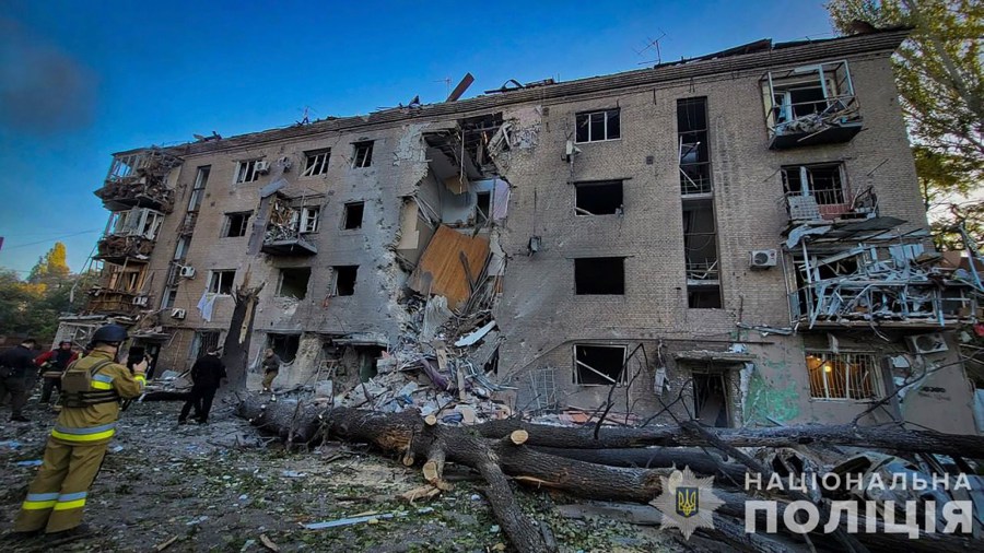 In this photo provided by the Ukrainian Police Press Office, a damaged apartment house is seen after Russia attacked the city with guided bombs overnight in Zaporizhzhia, Ukraine, Sunday, Sept. 29, 2024. (Ukrainian Police Press Office via AP)