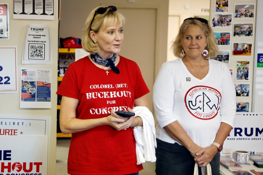 Congressional candidate Laurie Buckhout, R-N.C., left, speaks to supporters at the Nash County Republican headquarters in Rocky Mount, N.C., Friday, Sept. 20, 2024. (AP Photo/Karl B DeBlaker)