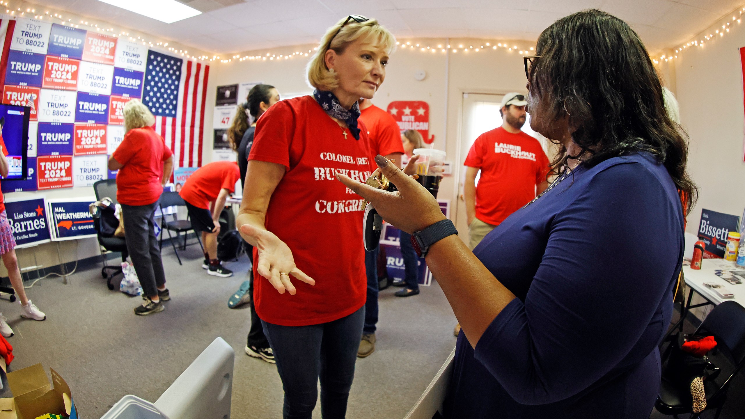 Congressional candidate Laurie Buckhout, R-N.C., left, speaks to a supporter at the Nash County Republican headquarters in Rocky Mount, N.C., Friday, Sept. 20, 2024. (AP Photo/Karl B DeBlaker)