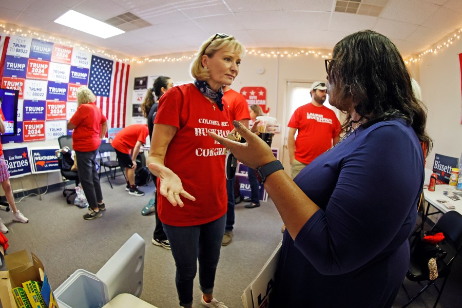 Congressional candidate Laurie Buckhout, R-N.C., left, speaks to a supporter at the Nash County Republican headquarters in Rocky Mount, N.C., Friday, Sept. 20, 2024. (AP Photo/Karl B DeBlaker)