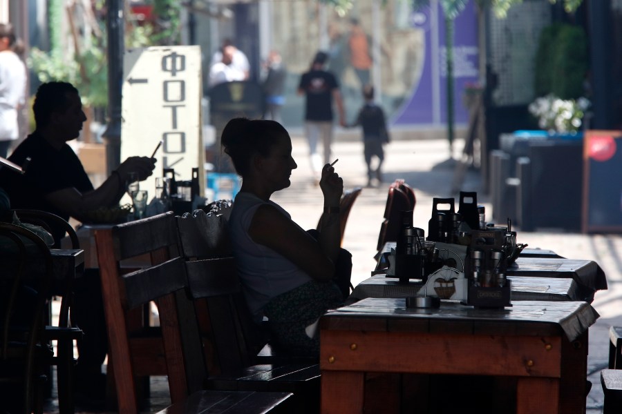 FILE - People sit in a restaurant in a street in the Old Bazaar, a day after the presidential and parliamentary elections, in Skopje, North Macedonia, on May 9, 2024. (AP Photo/Boris Grdanoski, File)