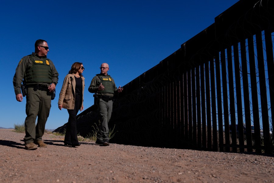 Democratic presidential nominee Vice President Kamala Harris talks with John Modlin, the chief patrol agent for the Tucson Sector of the U.S. Border Patrol, right, and Blaine Bennett, the U.S. Border Patrol Douglas Station border patrol agent in charge, as she visits the U.S. border with Mexico in Douglas, Ariz., Friday, Sept. 27, 2024. (AP Photo/Carolyn Kaster)