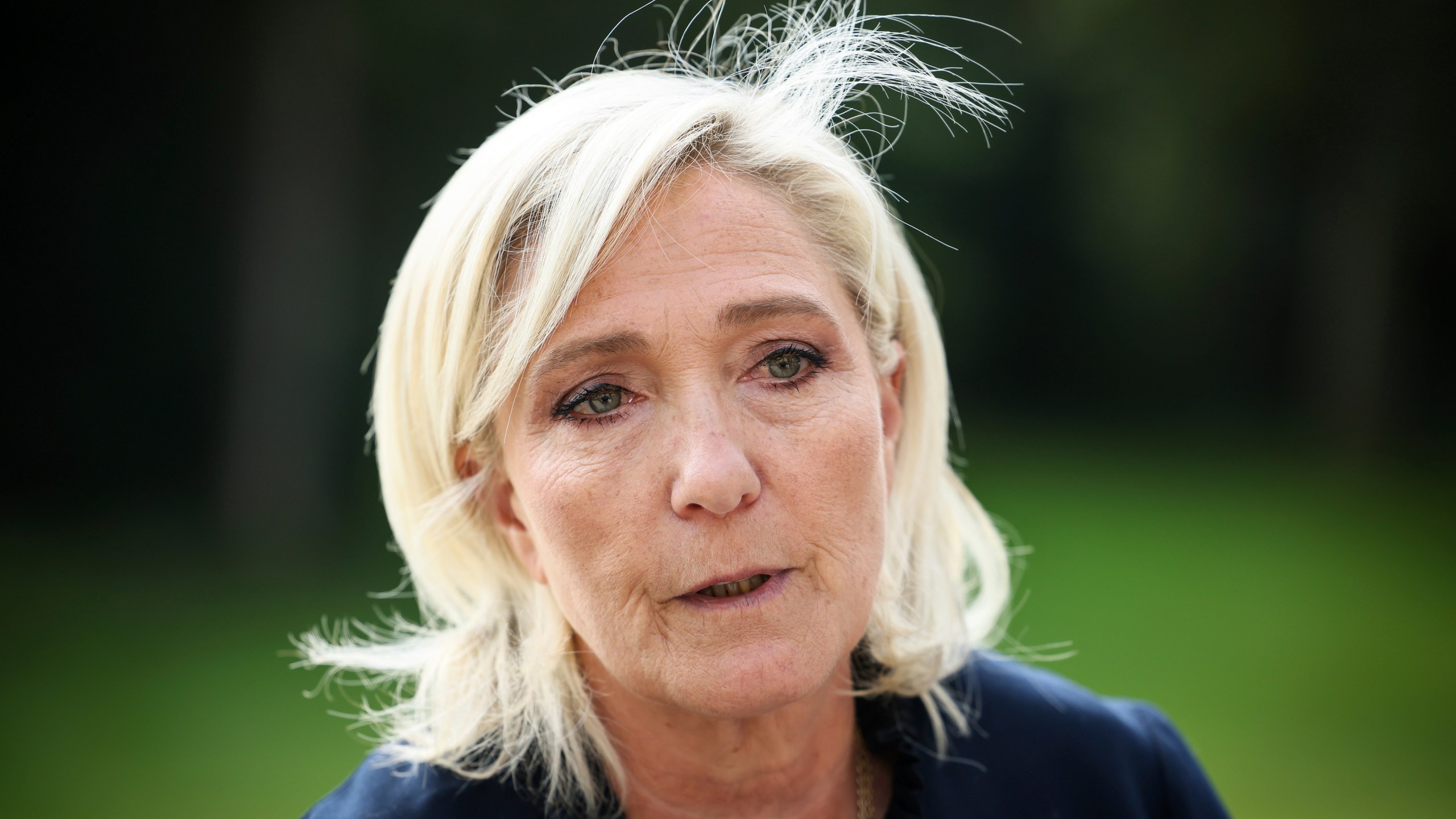 FILE - French far-right leader Marine Le Pen answers reporters at the Elysee Palace after a meeting with French President Emmanuel Macron, Aug. 26, 2024 in Paris. (AP Photo/Thomas Padilla, File)