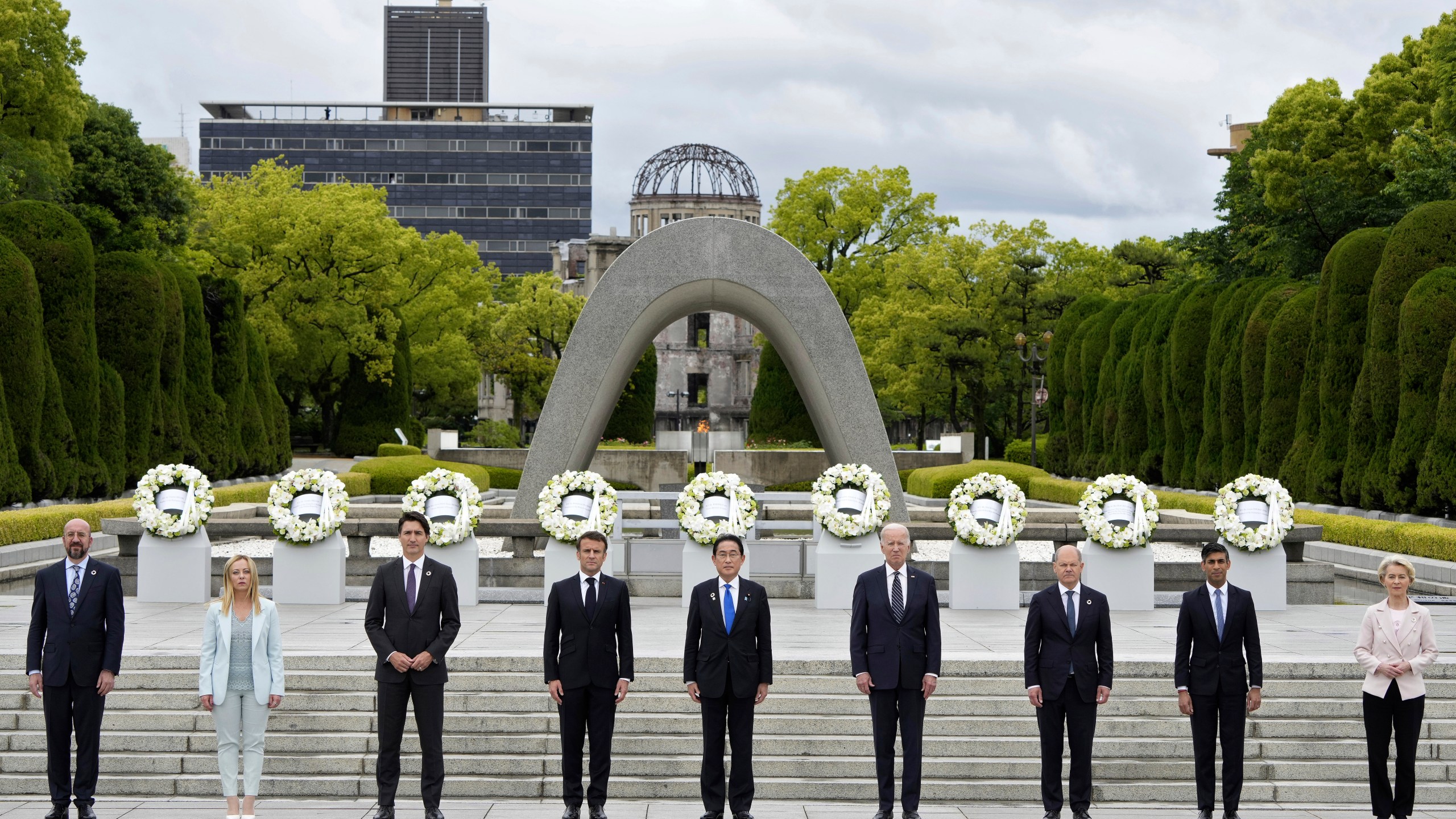 FILE - From left to right, European Council President Charles Michel, Italian Prime Minister Giorgia Meloni, Canadian Prime Minister Justin Trudeau, French President Emmanuel Macron, Japan's Prime Minister Fumio Kishida, U.S. President Joe Biden, German Chancellor Olaf Scholz, British Prime Minister Rishi Sunak, European Commission President Ursula von der Leyen pose for a group photo after laying flower wreaths at the cenotaph for Atomic Bomb Victims in the Peace Memorial Park as part of the G7 Hiroshima Summit in Hiroshima, Japan, on May 19, 2023. (Franck Robichon/Pool Photo via AP, File)