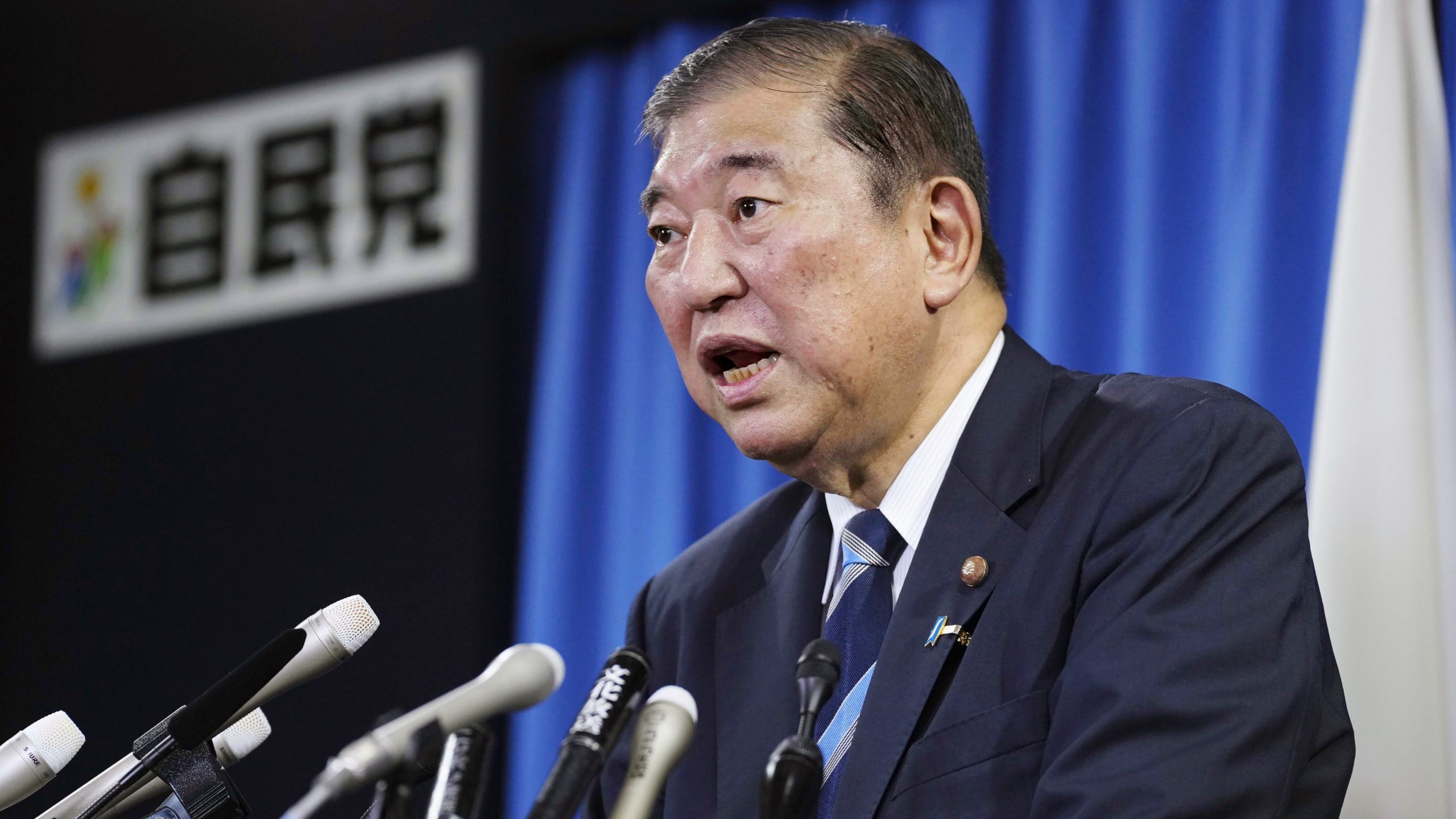 Shigeru Ishiba, the head of Japan's governing party, the Liberal Democratic Party speaks during a press conference at the party's headquarters in Tokyo Monday, Sept. 30, 2024 to announce that he plans to call a parliamentary election on Oct. 27 after he is formally elected as prime minister. (Kyodo News via AP)