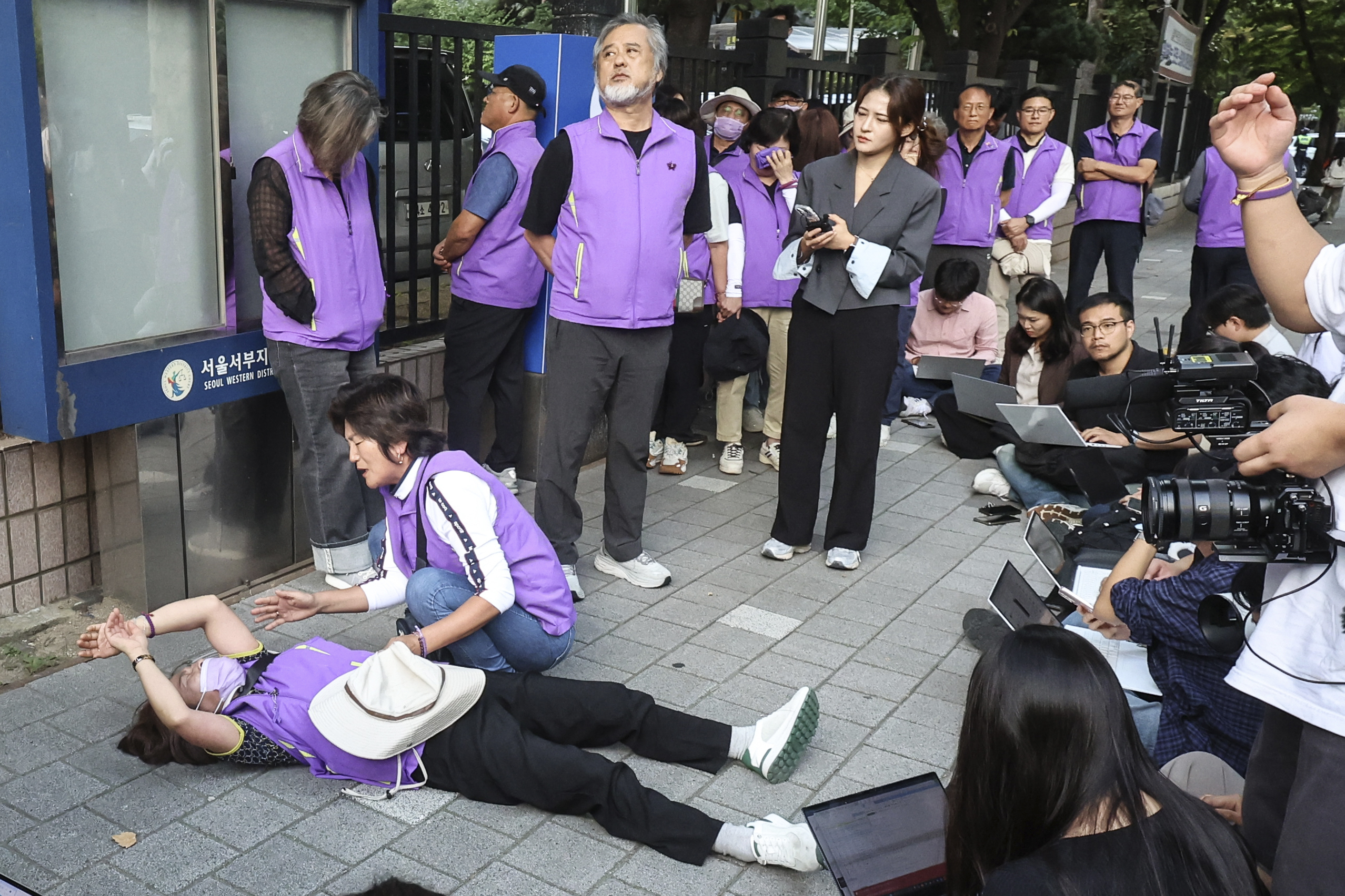 Bereaved family members of the victims of the Halloween crush in 2022 react at the Seoul Western District Court in Seoul, South Korea, Monday, Sept. 30, 2024. (Kim Geun-soo/Newsis via AP)