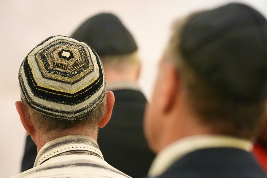 Men wear yarmulkes as they attend a Shabbat service, Friday, Sept. 27, 2024, at Temple Beth Sholom in Miami Beach, Fla. (AP Photo/Wilfredo Lee)