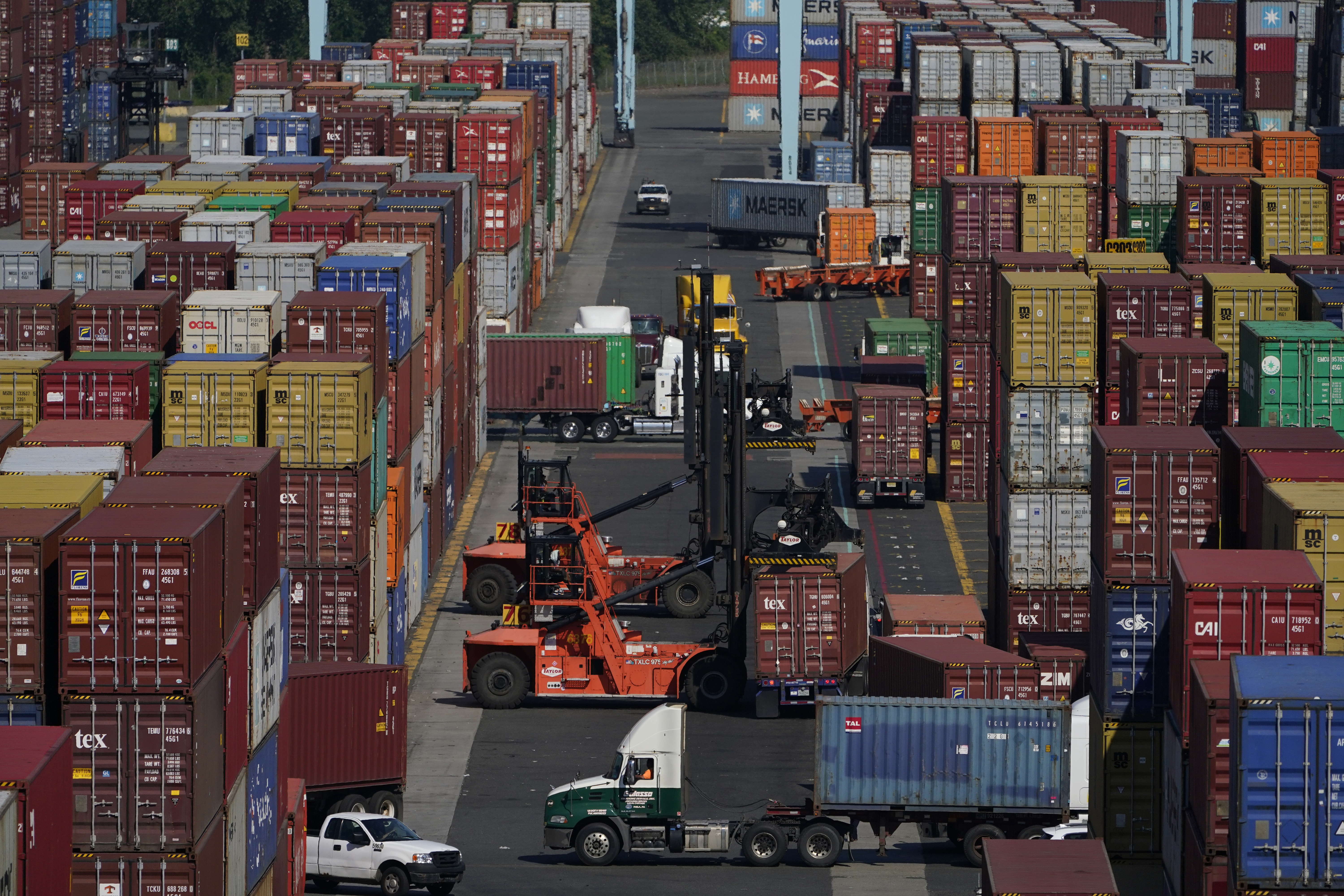 FILE - Containers are moved at the Port of New York and New Jersey in Elizabeth, N.J., on June 30, 2021. (AP Photo/Seth Wenig, File)