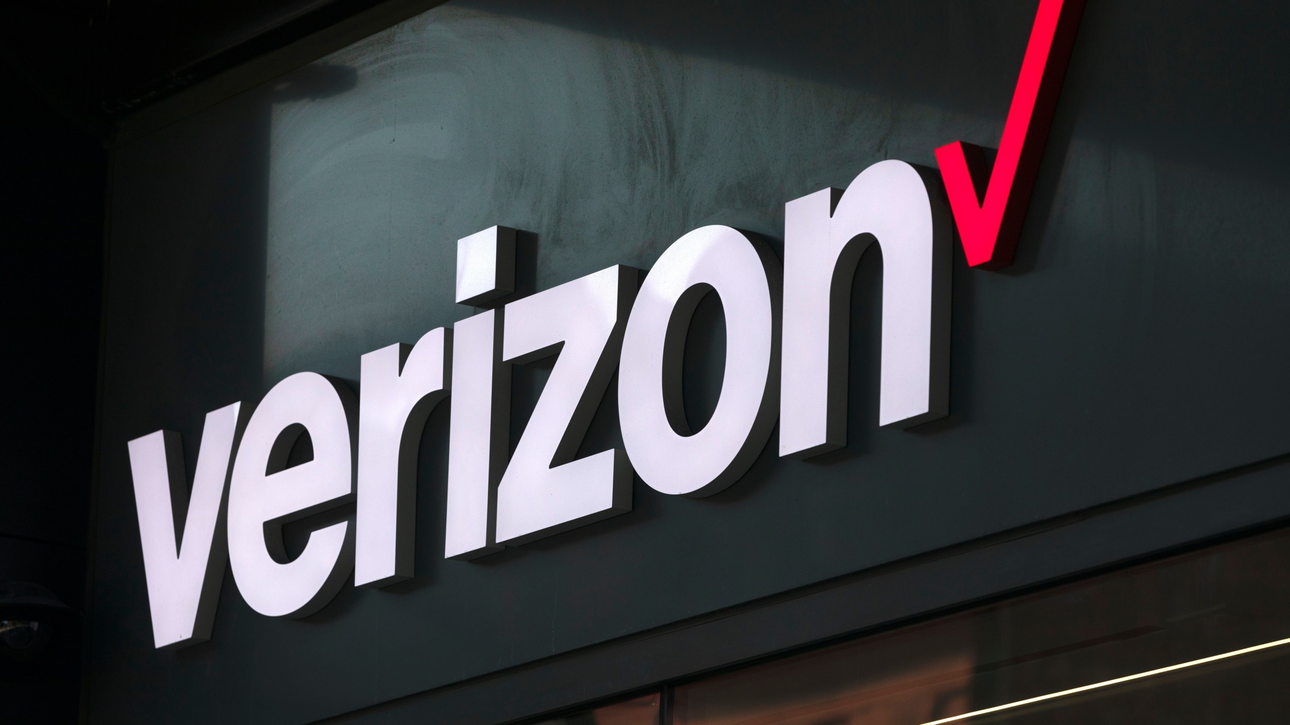 FILE - The Verizon logo is seen on a storefront, Friday, Sep. 1, 2023, in Boston. (AP Photo/Michael Dwyer, File)