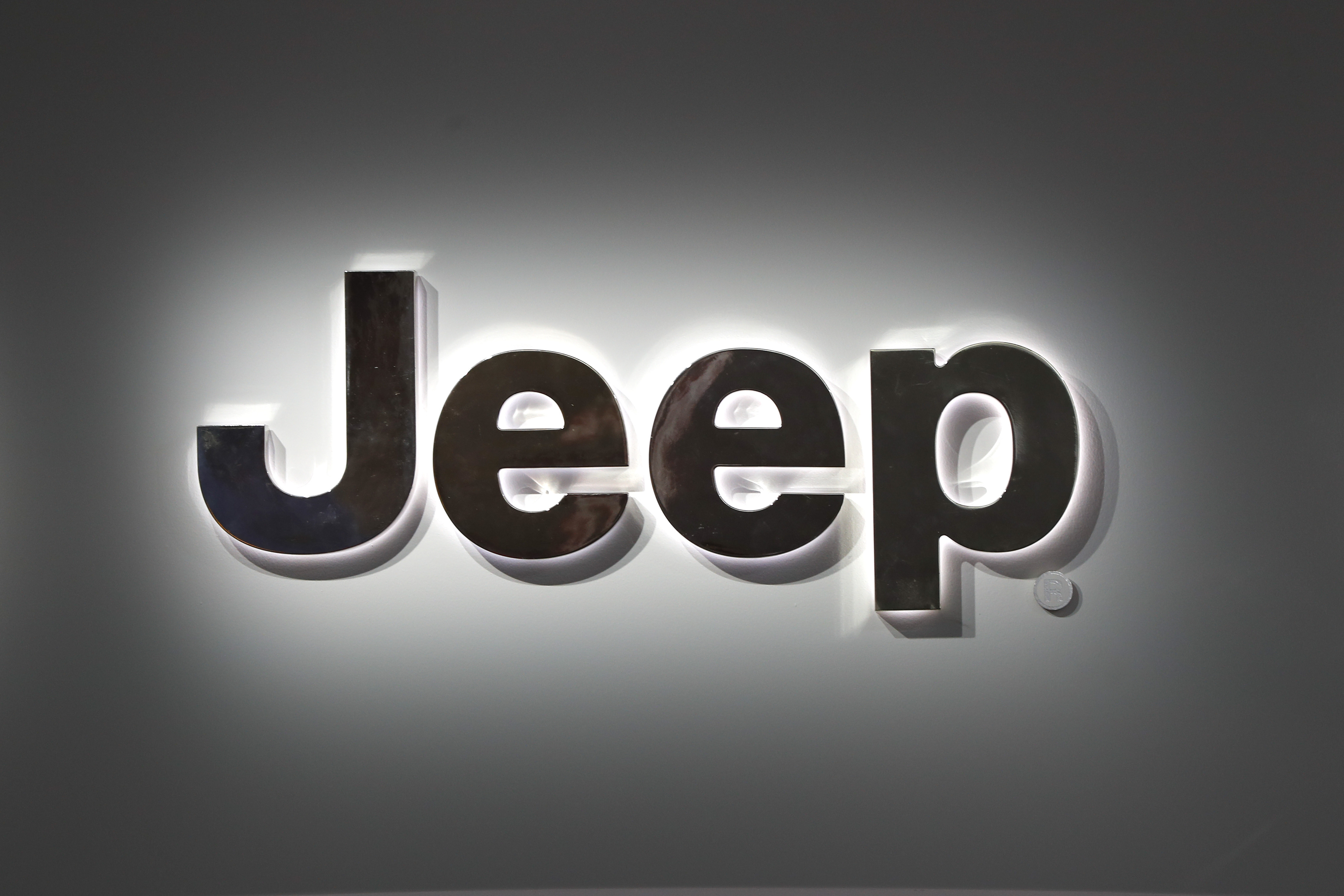 FILE - A Jeep logo is displayed at the North American International Auto Show in Detroit, Jan. 14, 2019. (AP Photo/Paul Sancya, File)