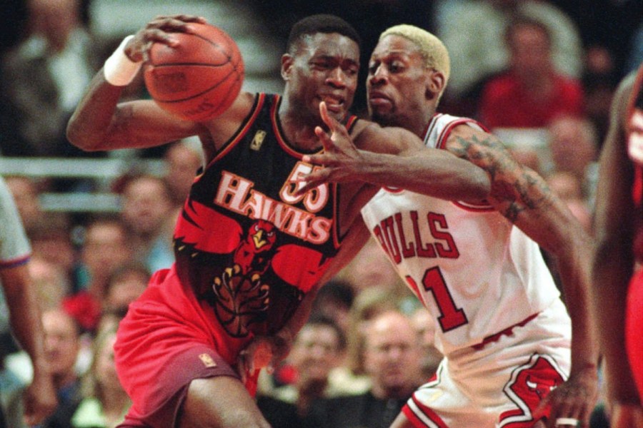 FILE - The Atlanta Hawks' Dikembe Mutombo, left, drives to the hoop against the Chicago Bulls' Dennis Rodman during the second quarter of their playoff game Thursday, May 8, 1997, in Chicago. (AP Photo/Michael S. Green, File)