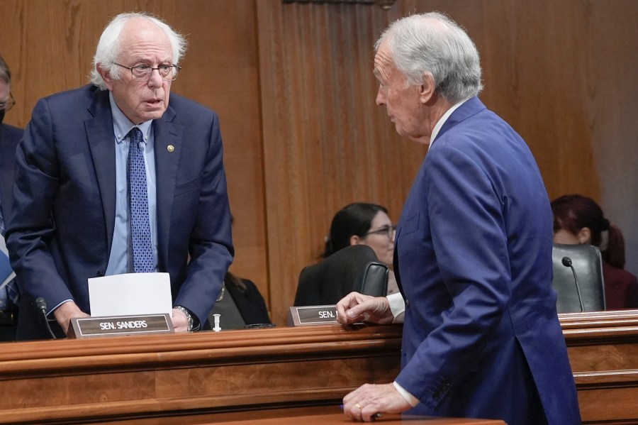 Sen. Bernie Sanders, I-Vt., left, speaks with Sen. Edward Markey, D-Mass., right, after a Senate Health, Education, Labor, and Pensions Committee business meeting on Capitol Hill, Thursday, Sept. 19, 2024, in Washington. (AP Photo/Mariam Zuhaib)