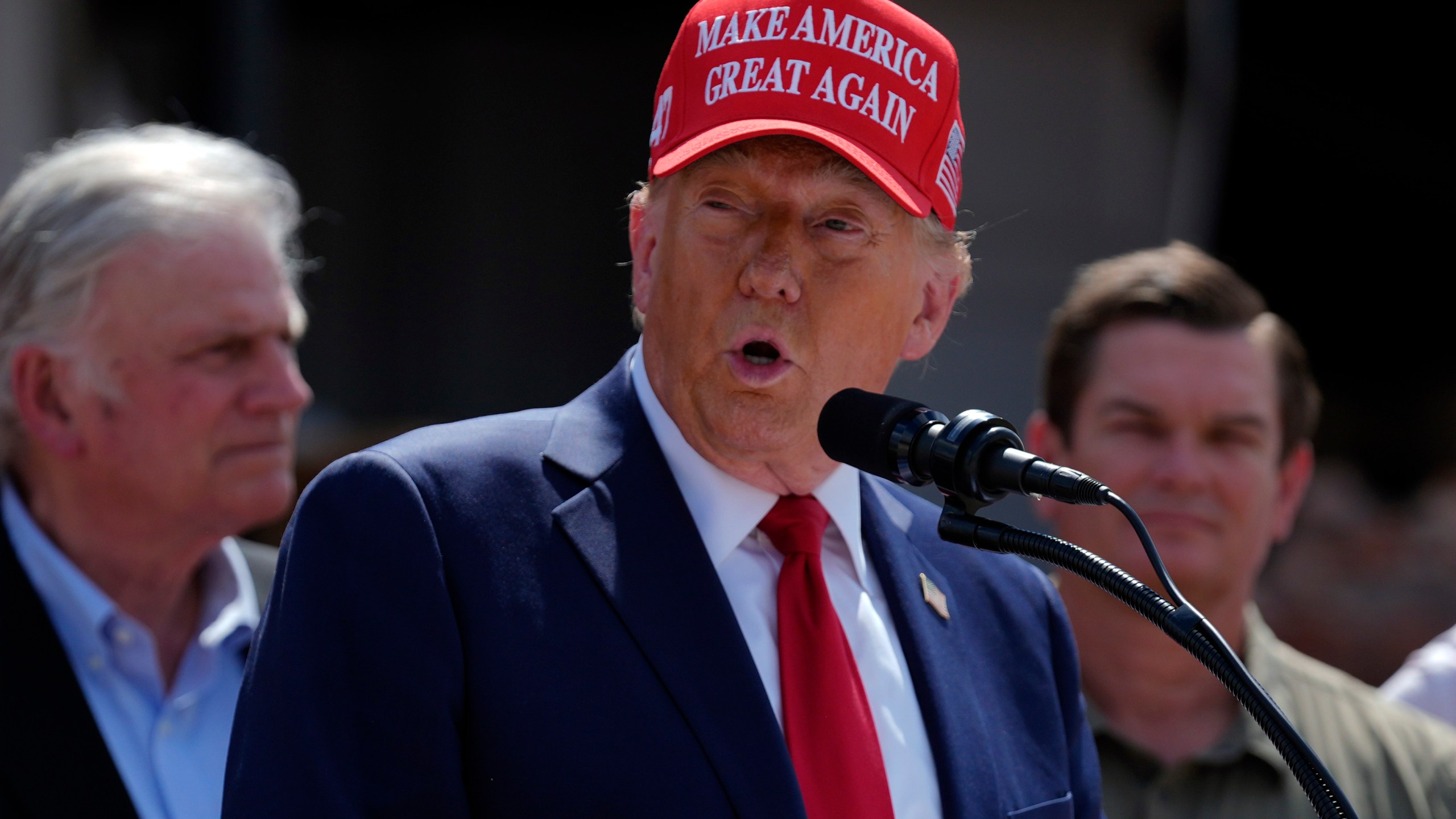 Republican presidential nominee former President Donald Trump speaks outside the Chez What furniture store as he visits Valdosta, Ga., a town impacted by Hurricane Helene, Monday, Sept. 30, 2024. (AP Photo/Evan Vucci)