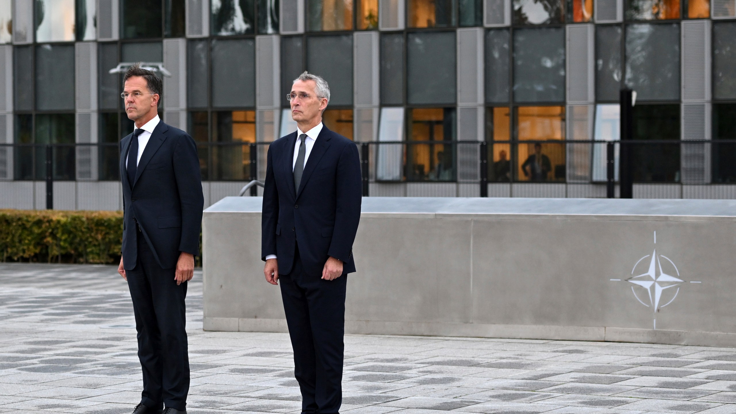 NATO Secretary General Jens Stoltenberg, right, and the incoming NATO Secretary General Mark Rutte stand during a wreath laying ceremony at NATO headquarters in Brussels, Belgium, Tuesday, Oct. 1, 2024. (AP Photo/Harry Nakos)