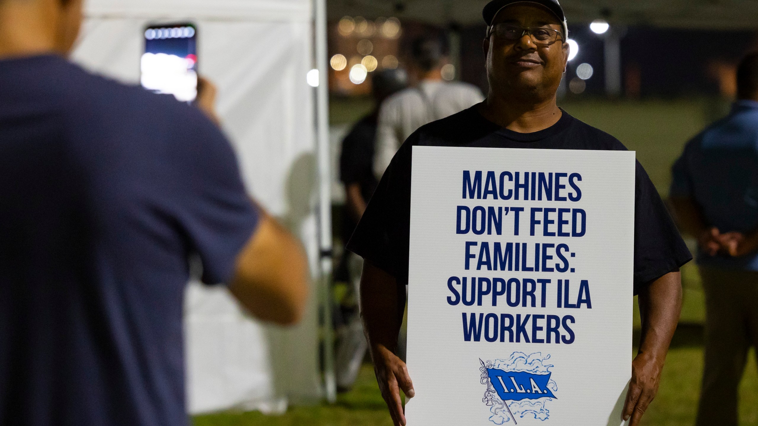 Longshoremen strike at midnight at Bayport Terminal on Tuesday, Oct. 1, 2024, in Houston. (AP Photo/Annie Mulligan)