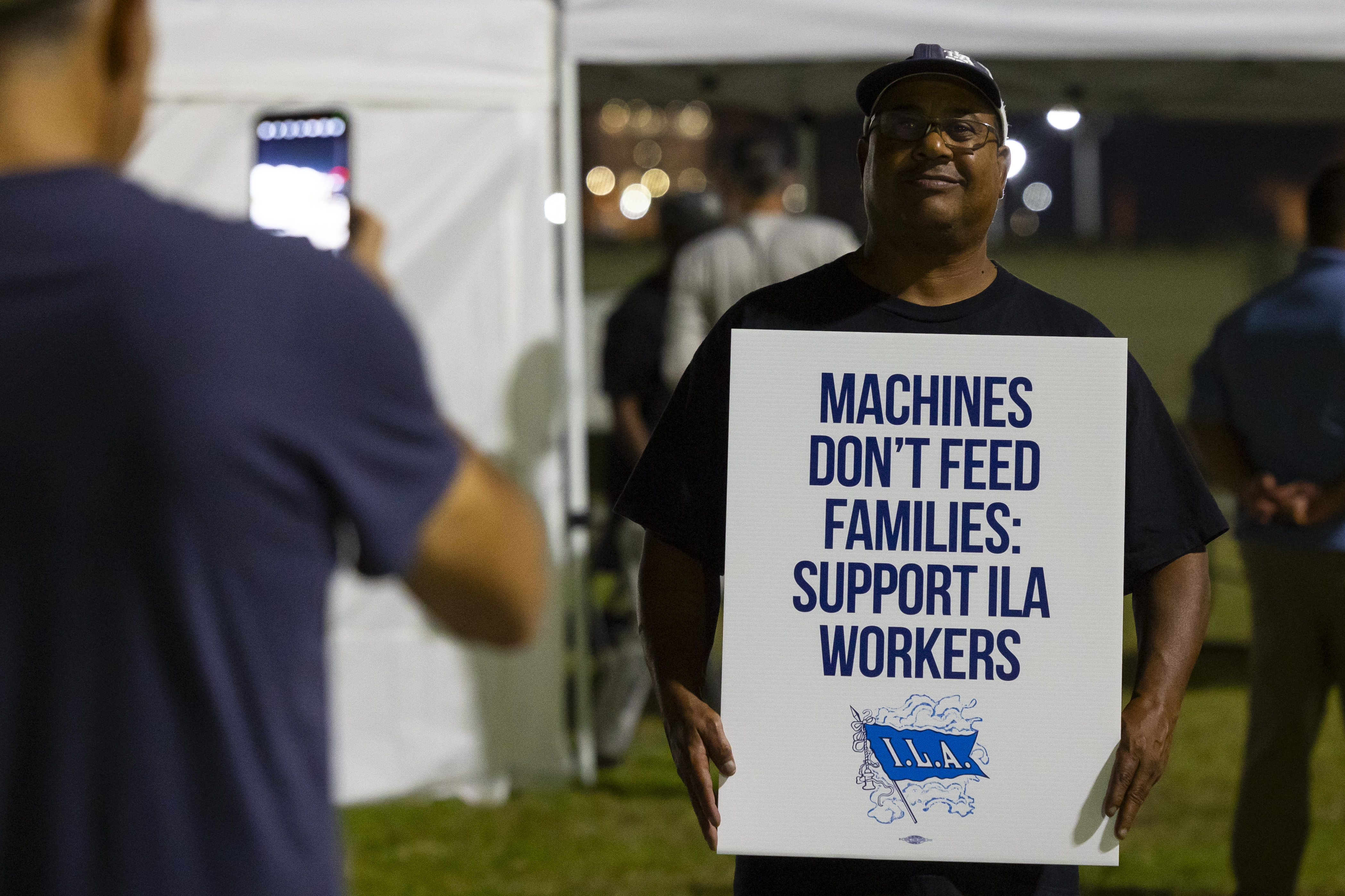 Longshoremen strike at midnight at Bayport Terminal on Tuesday, Oct. 1, 2024, in Houston. (AP Photo/Annie Mulligan)